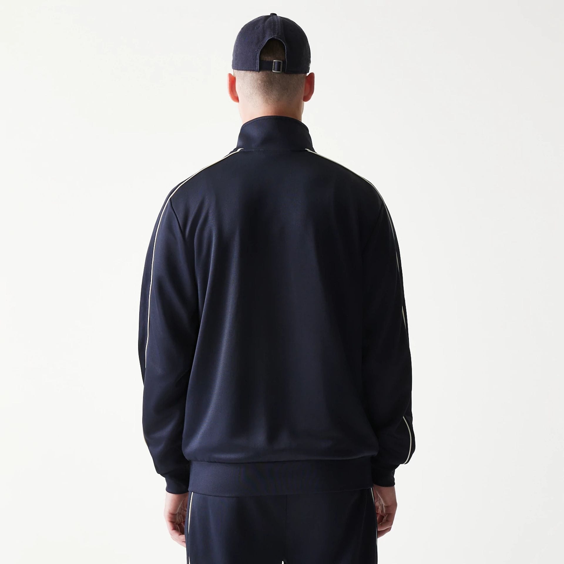 The model is wearing this MLB Piping New York Yankees Track Jacket in navy. 2