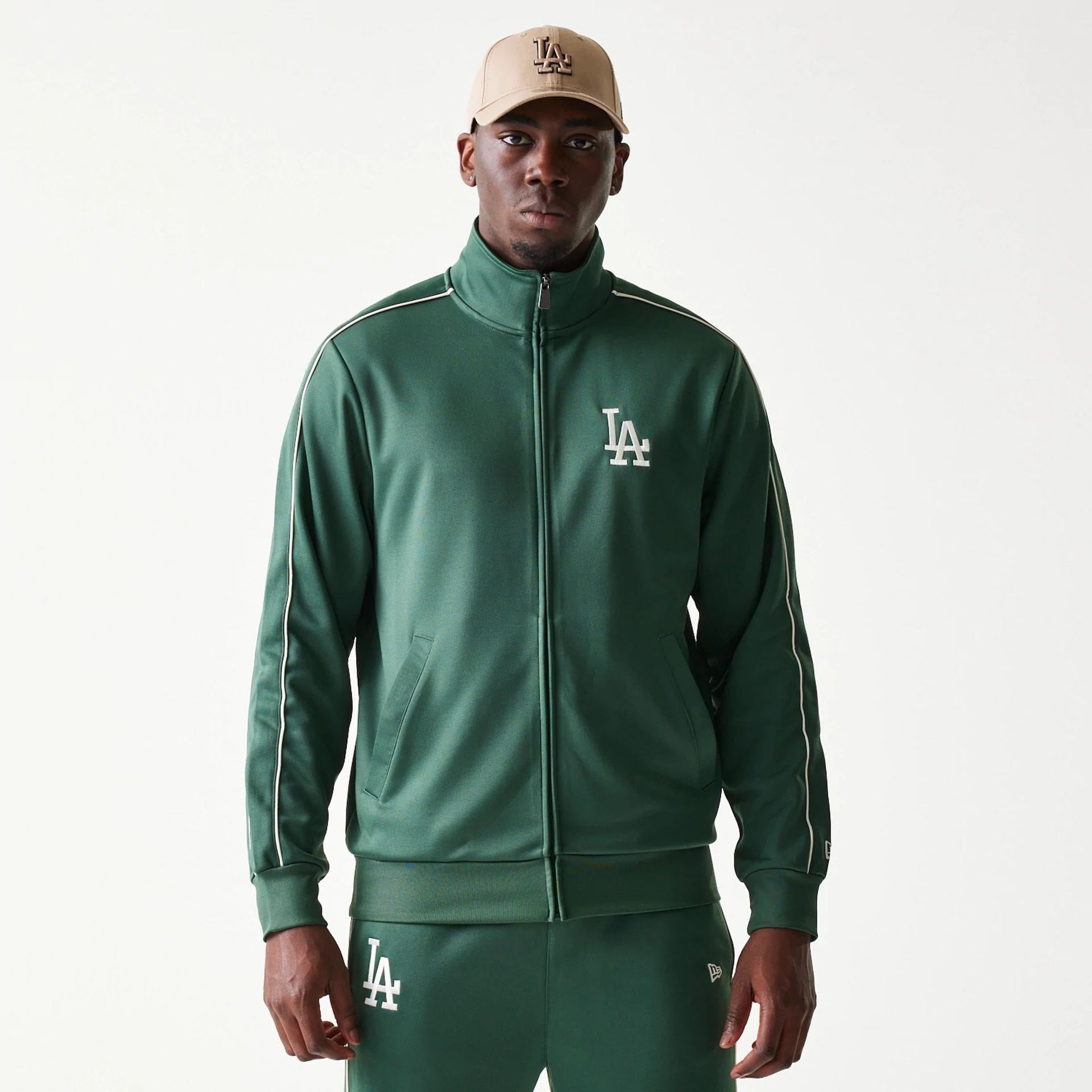 The model is wearing this MLB Piping LA Dodgers Track Jacket in dark green. 1
