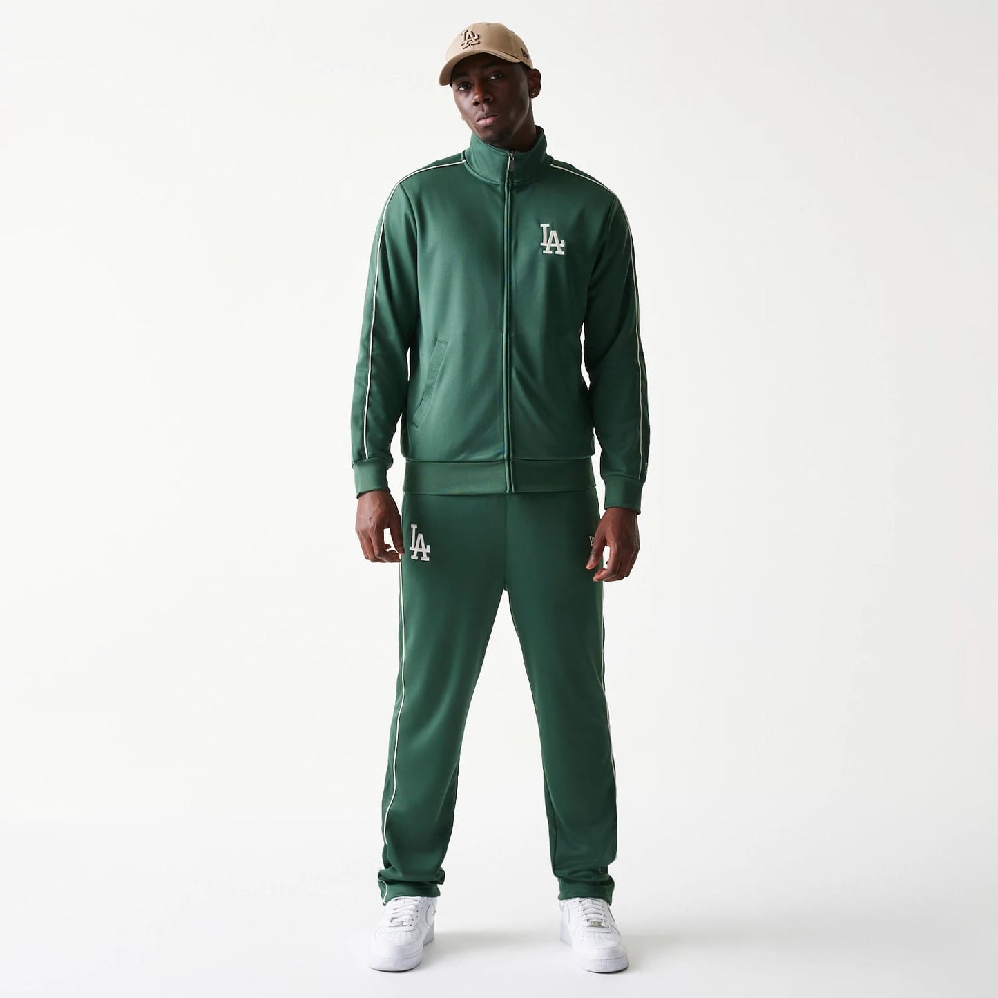 The model is wearing this MLB Piping LA Dodgers Track Jacket in dark green. 8