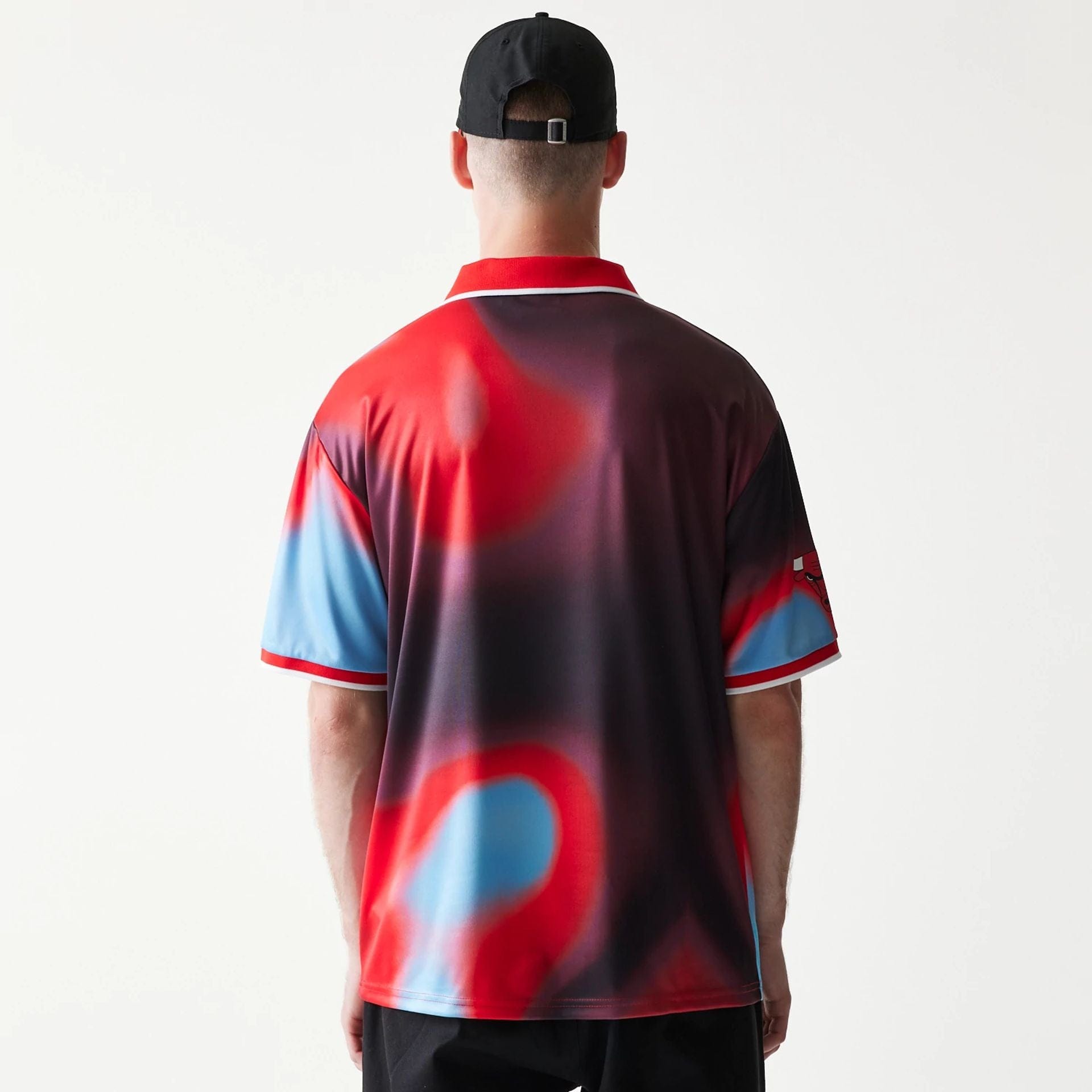 The model is wearing this NBA All Over Print Chicago Bulls T-Shirt in red. 2