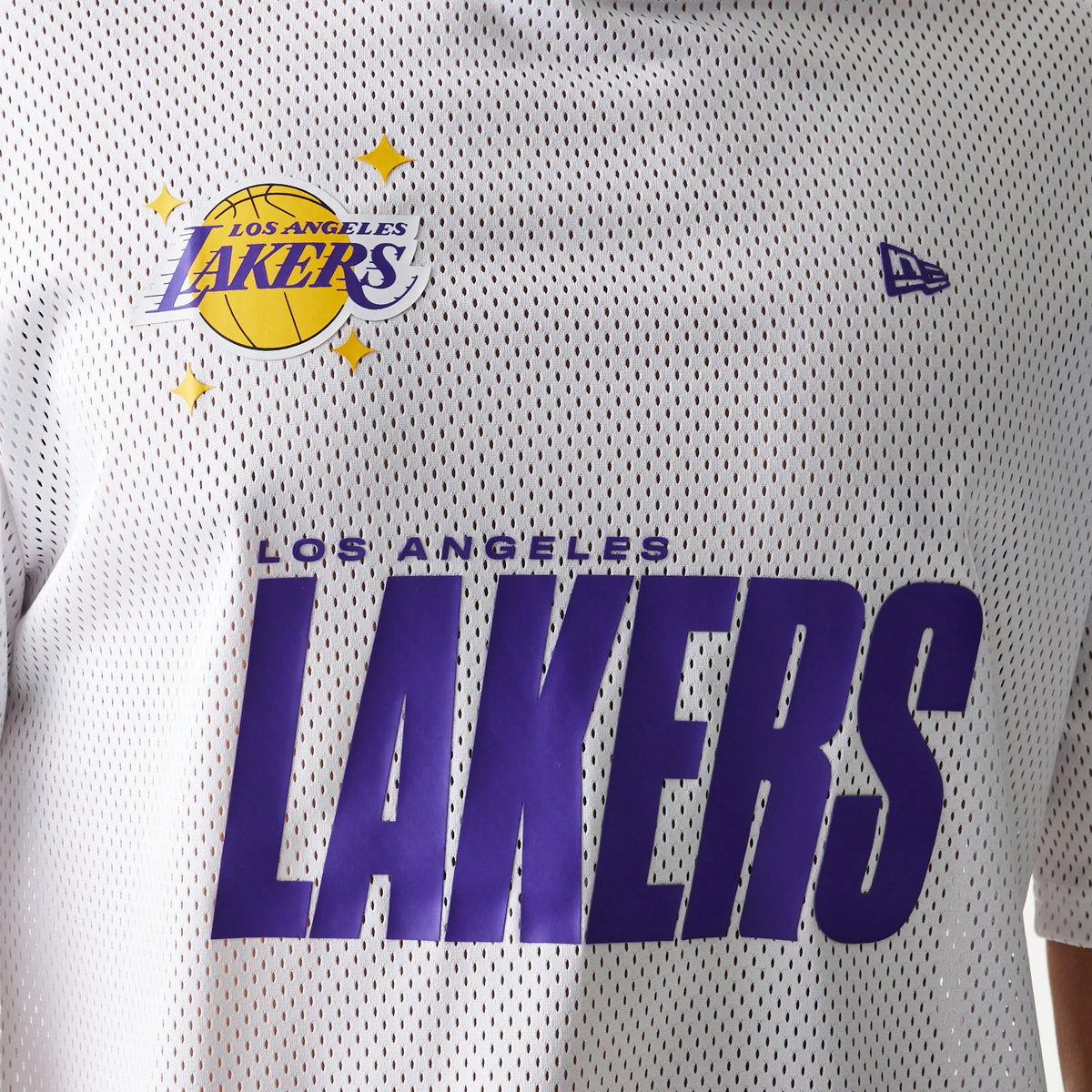 New Era LA Lakers NBA Graphic Mesh White T-Shirt, front view showing large purple Lakers lettering across the chest, the Los Angeles Lakers logo with stars on the upper chest, and an embroidered New Era logo on the right sleeve.