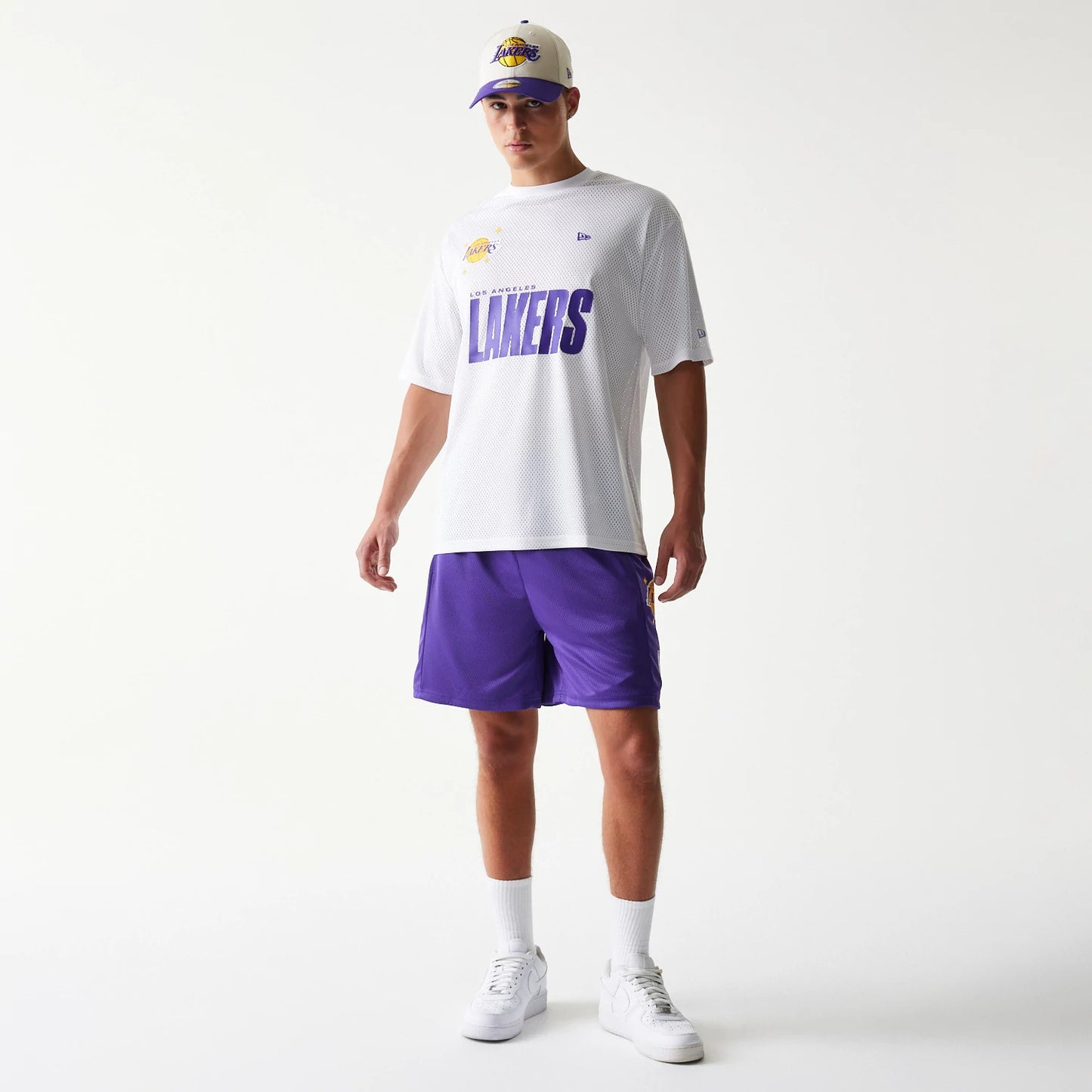 The model is wearing this NBA Mesh LA Lakers Shorts in purple. 8