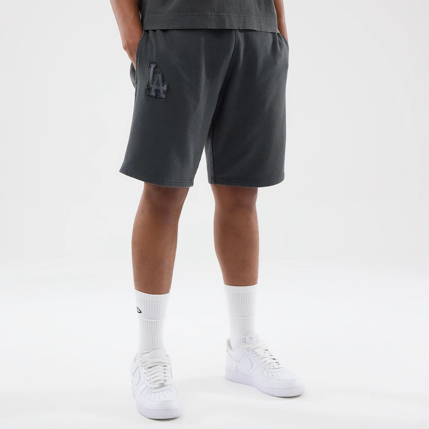 The model is wearing this MLB Washed LA Dodgers Shorts in Dark Grey. 7