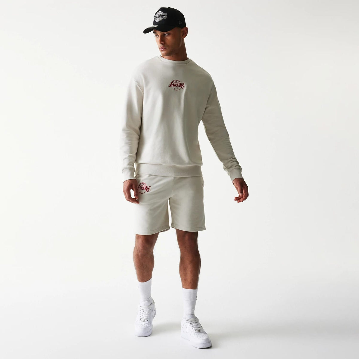 The model is wearing this NBA League Essential LA Lakers Shorts in light beige. 8