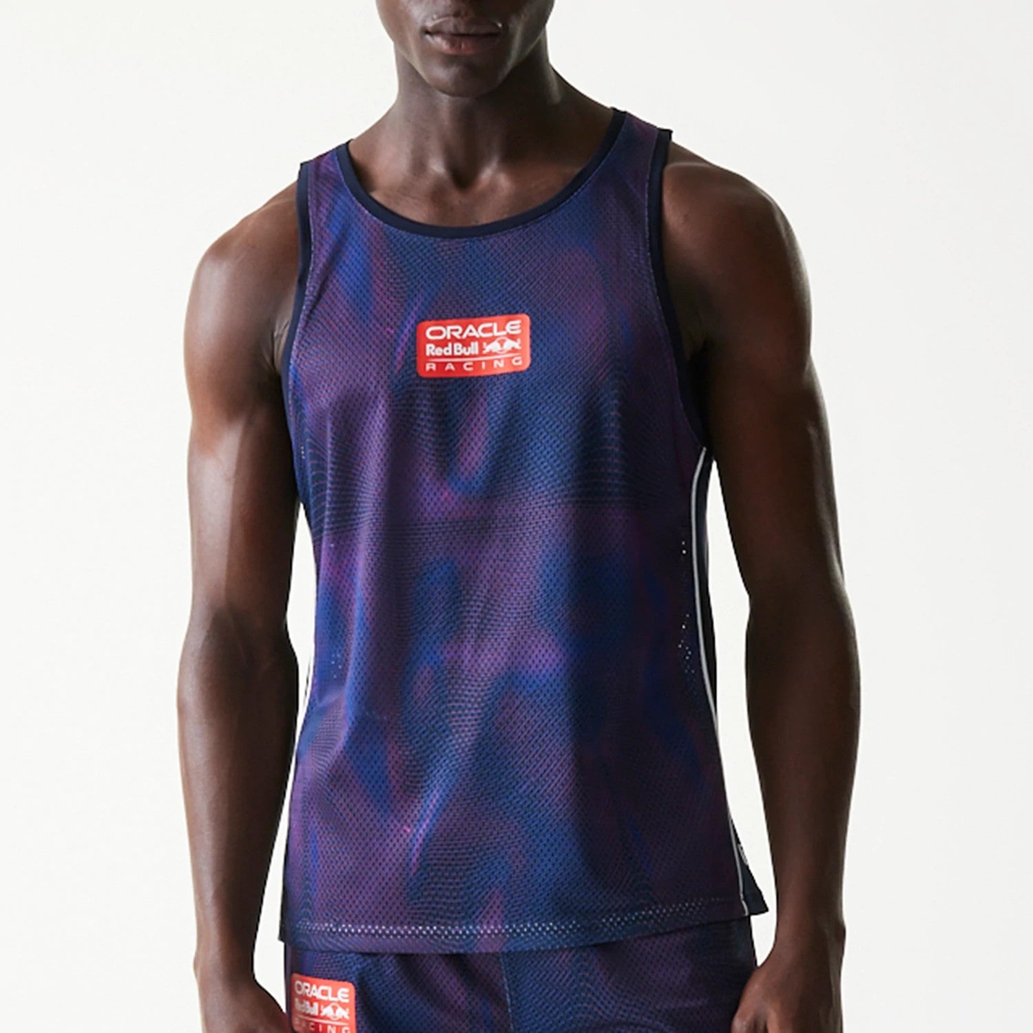 The model is wearing this Red Bull Racing Mesh Tank Top in dark blue. 3