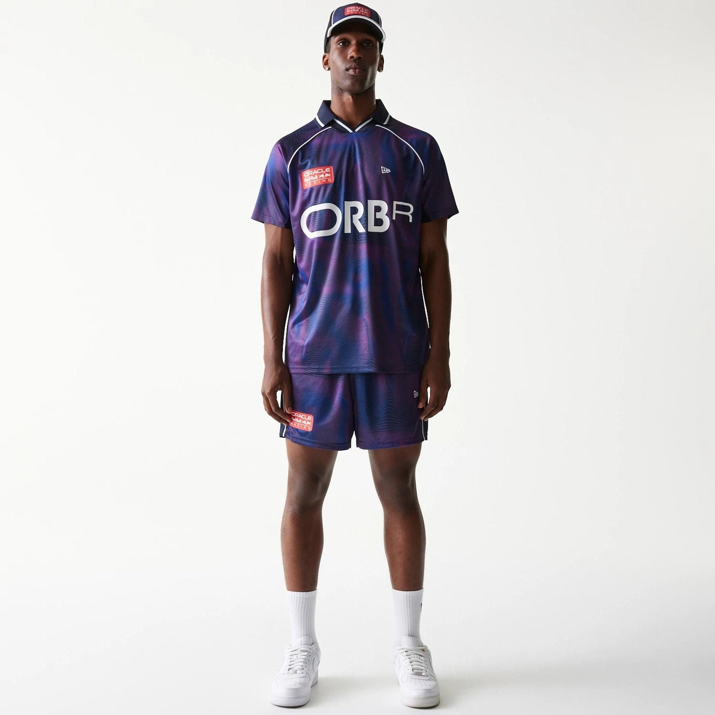 The model is wearing this Red Bull Racing All Over Print Football Shorts in dark blue. 8