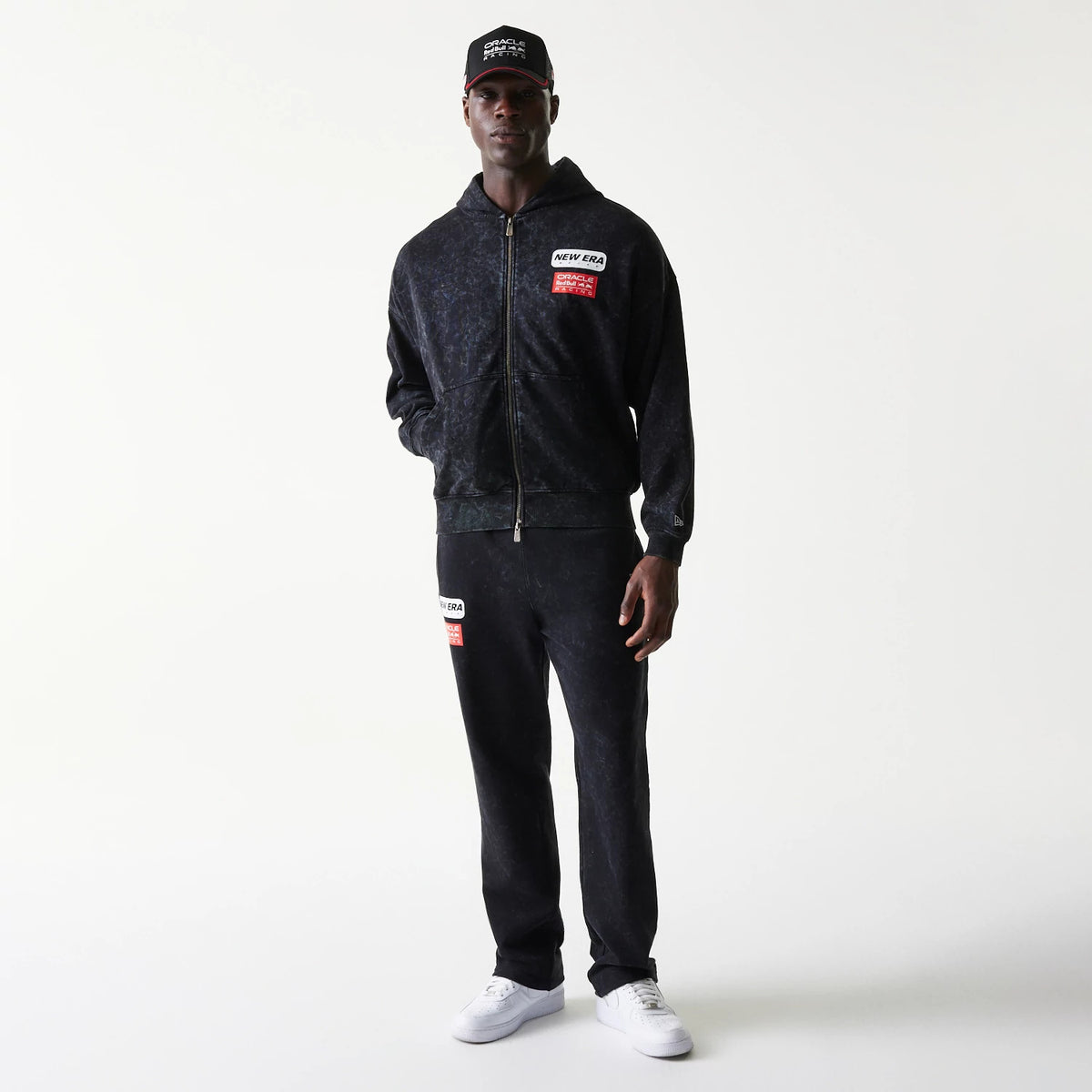 The model is wearing this Red Bull Racing Dropped Shoulder Full Zip Hoodie in black. 8