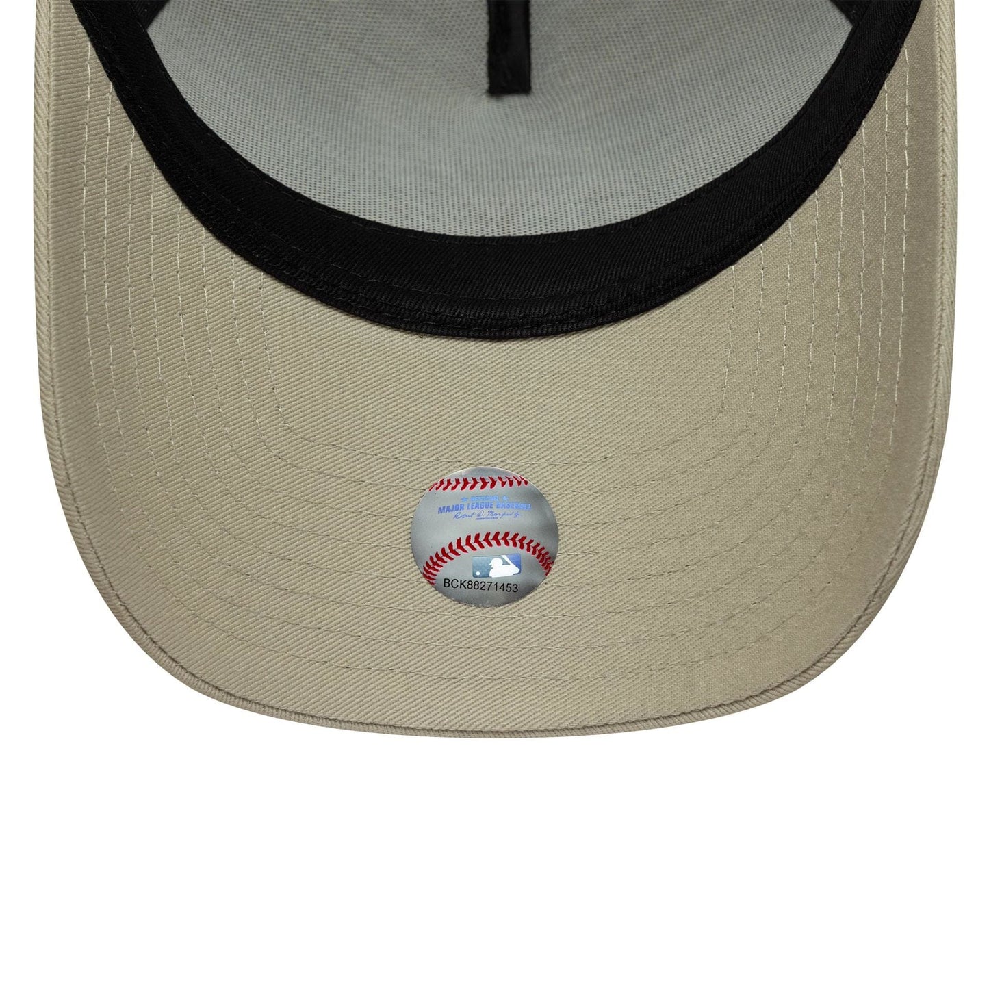 Pictured is this MLB League Essential New York Yankees 9FORTY A-Frame Trucker in light beige. 5