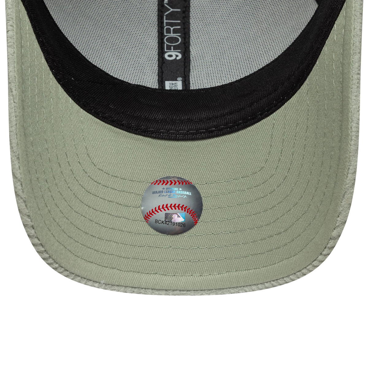 New York Yankees Womens MLB Pastel Cord Green New Era 9FORTY M-Crown Cap, inside view showing black sweatband, grey taping with 9FORTY branding, and a baseball-themed sticker on the green undervisor.