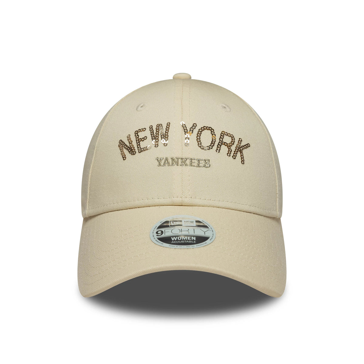 New York Yankees Womens MLB Sequin Wordmark Light Beige New Era 9FORTY Cap, front view showing the sparkling gold sequin New York text and flat white Yankees embroidery, with a light beige curved visor and 9FORTY size sticker.