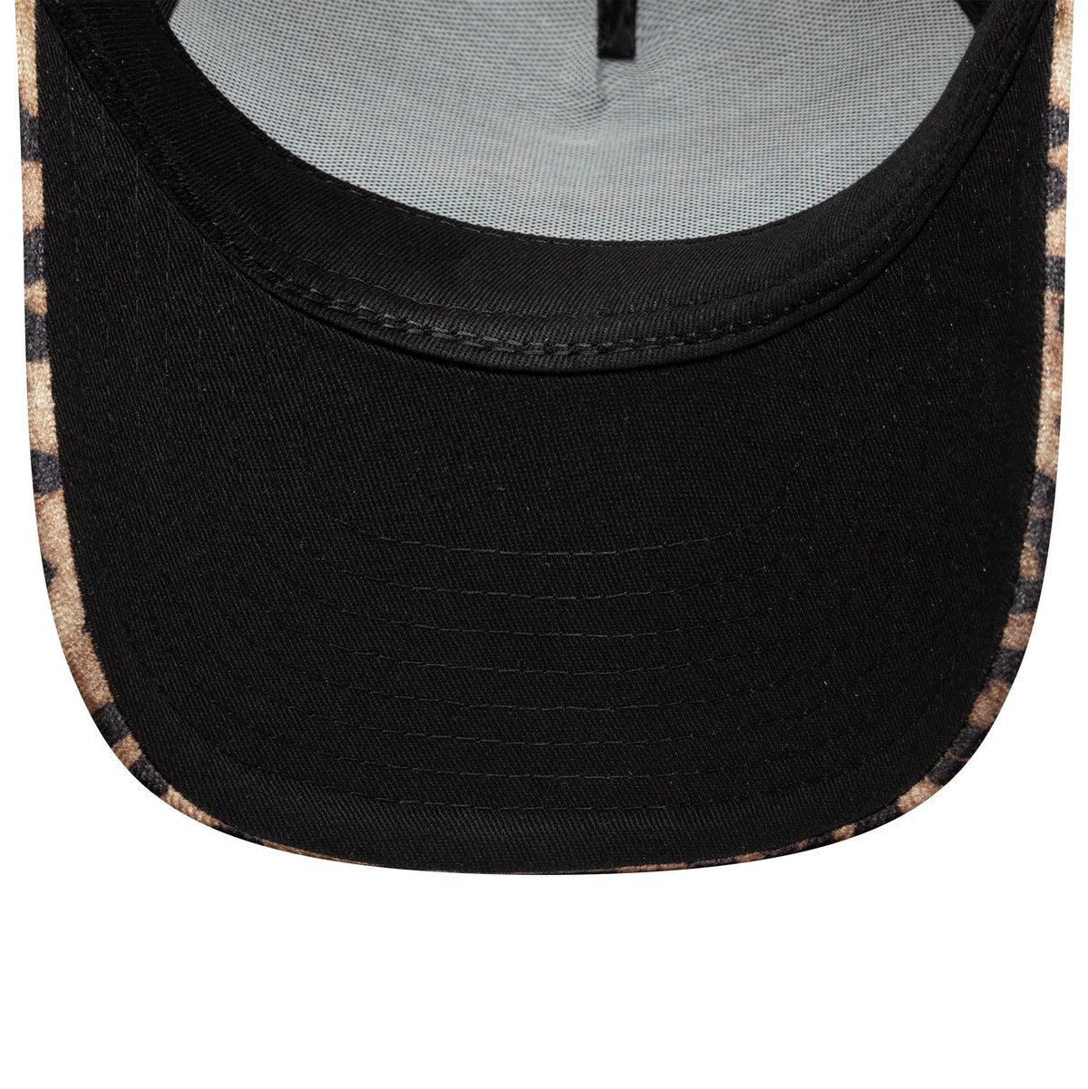Womens New Era Leopard Light Beige 9FORTY M-Crown A-Frame Trucker Cap, inside view showing the light beige and black leopard print sweatband and the plain black undervisor under the structured crown.
