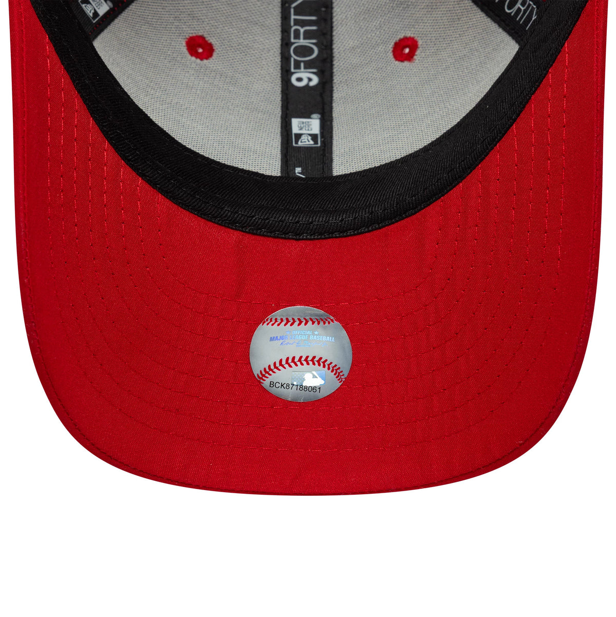 New York Yankees Youth MLB Flawless Red New Era 9FORTY Cap, inside view showing the black sweatband and taping with 9FORTY branding, red eyelets on a grey underpanel, and a central transparent Major League Baseball sticker on the red undervisor.