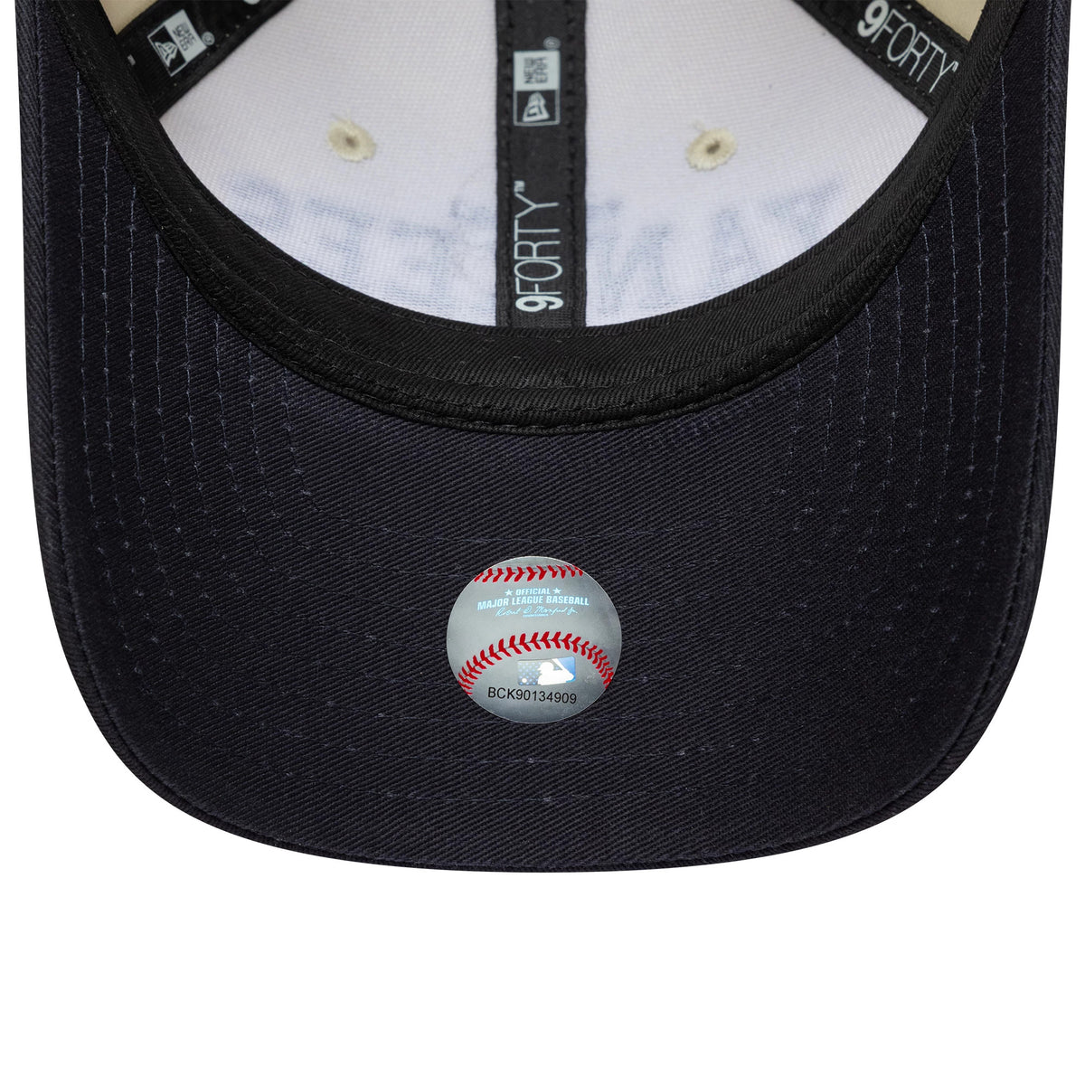 New York Yankees Youth MLB Wordmark Black New Era 9FORTY M-Crown Cap, inside view showing the black sweatband with white 9FORTY lettering, black taping, and a baseball-shaped authenticity sticker on the black undervisor.