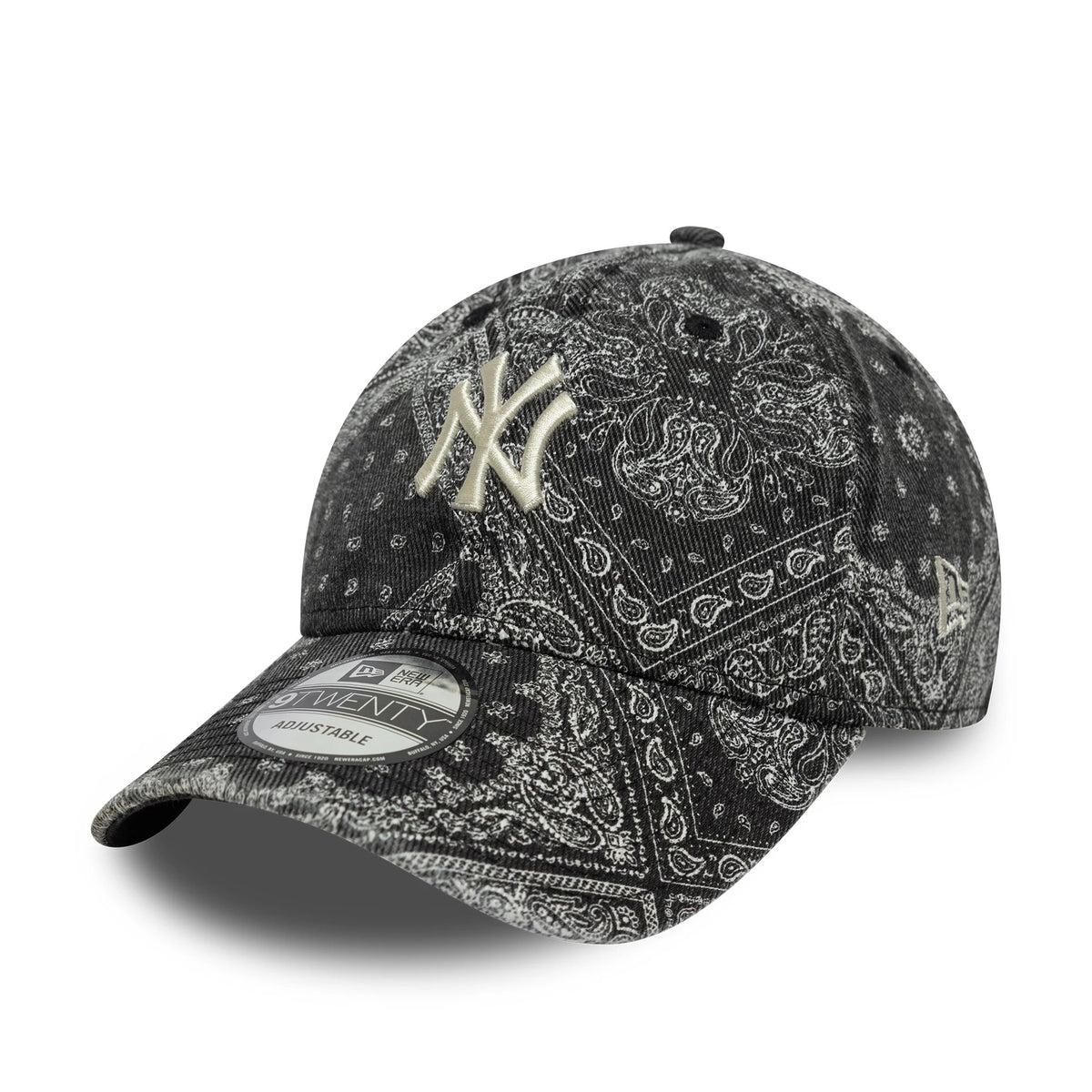 New York Yankees MLB Washed Paisley Black New Era 9TWENTY Cap, three-quarter view showing the cream raised NY logo embroidered on the patterned front panel, a black curved visor with a 9TWENTY size sticker, and the New Era flag logo on the left side.