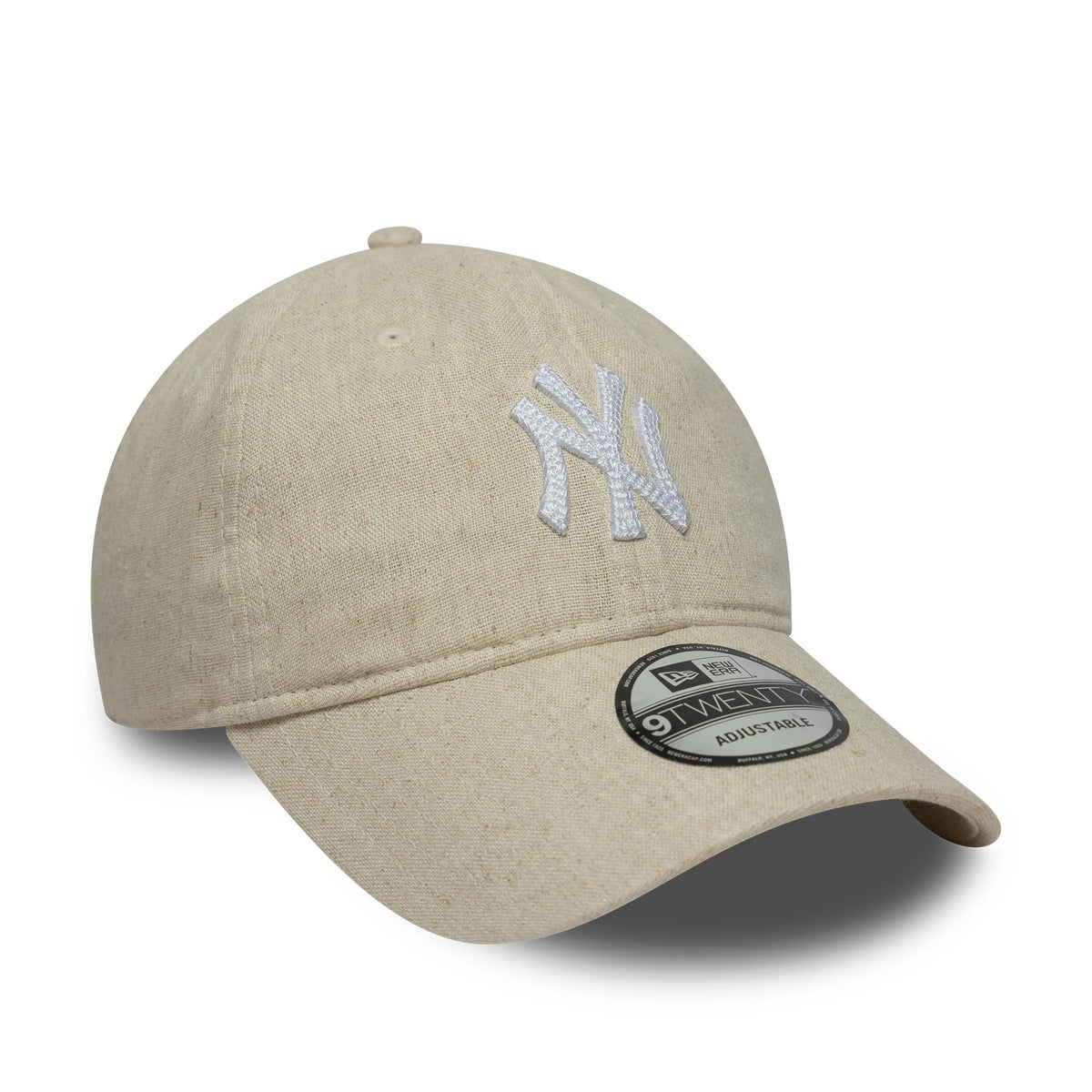 New York Yankees MLB Linen Light Beige New Era 9TWENTY Adjustable Cap, three-quarter view showing the raised white embroidered NY logo on the unstructured light beige crown and a 9TWENTY size sticker on the curved visor.