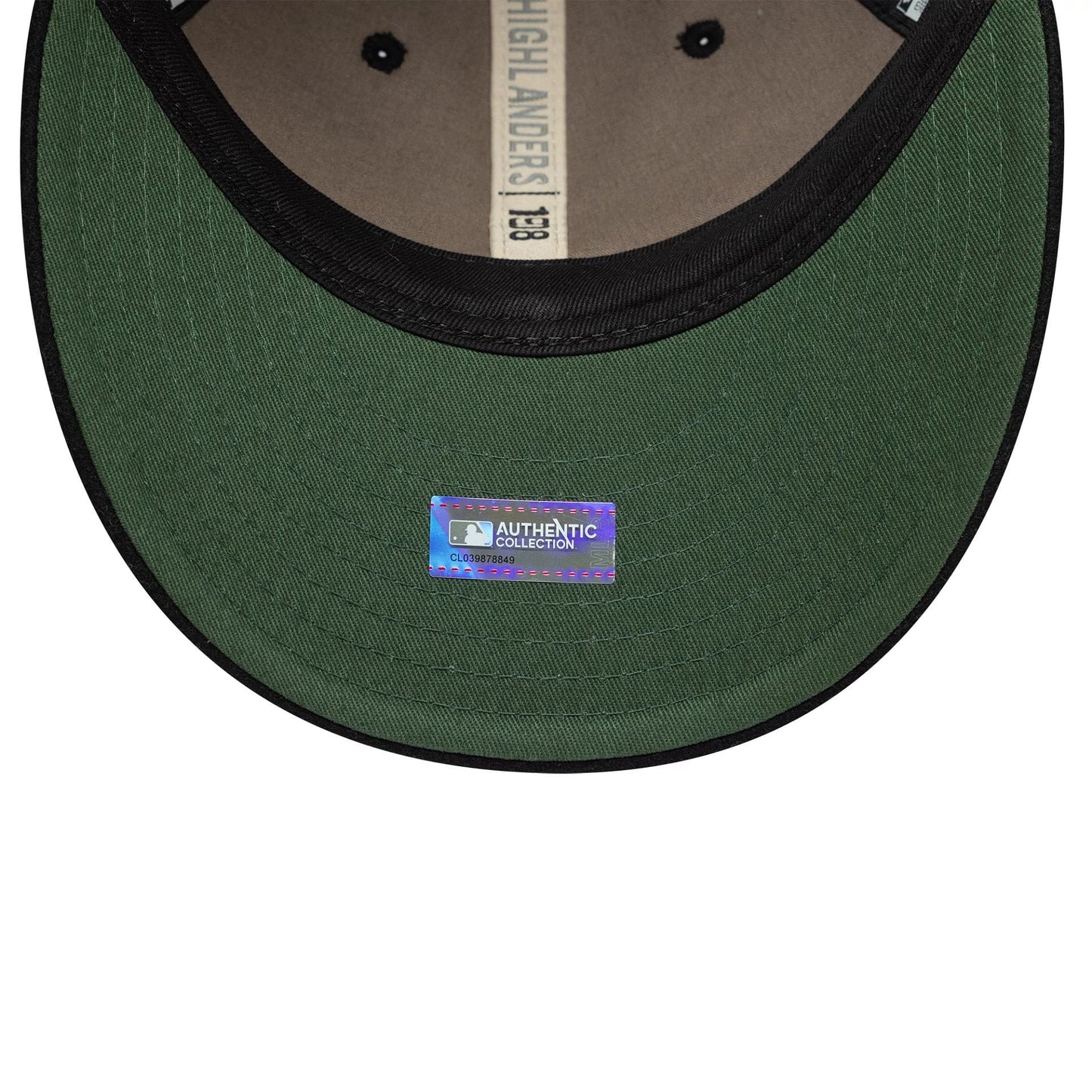 New York Highlanders MLB Heritage Black Retro Crown New Era 9FIFTY Cap, inside view showing a green undervisor with an MLB Authentic Collection sticker and black taping along the edges displaying the Highlanders name.