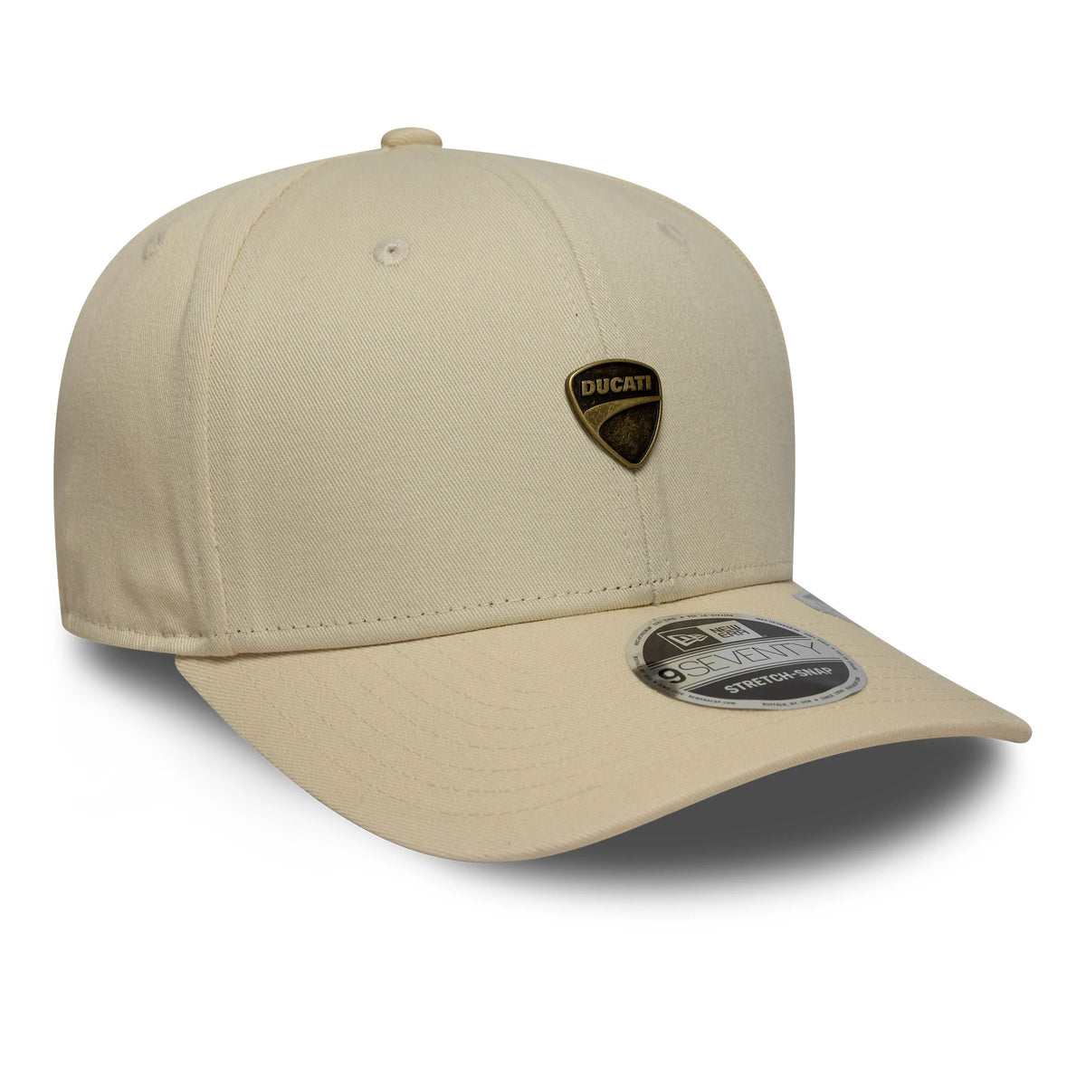 Ducati Motor Logo Light Beige New Era 9SEVENTY Stretch Snap Cap, three-quarter view showing a gold and black Ducati motor logo on the front panel, curved beige visor, and 9SEVENTY size sticker on the visor.