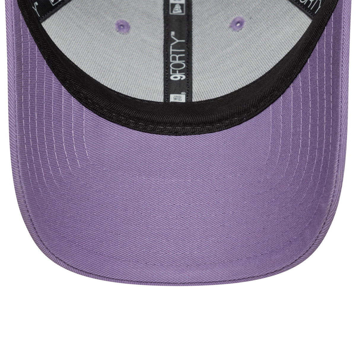 Tottenham Hotspur FC Pastel Purple New Era 9FORTY Adjustable Cap, inside view showing the black sweatband, grey interior panels with lavender eyelets, and displaying the 9FORTY label on the black taping above the pastel purple curved visor.