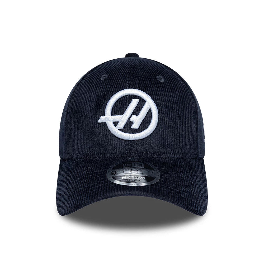 TGR Haas F1 Cord Navy New Era 9FORTY Cap, front view showing the white embroidered A logo on the structured navy corduroy crown, with a curved visor and a 9FORTY size sticker on the centre.