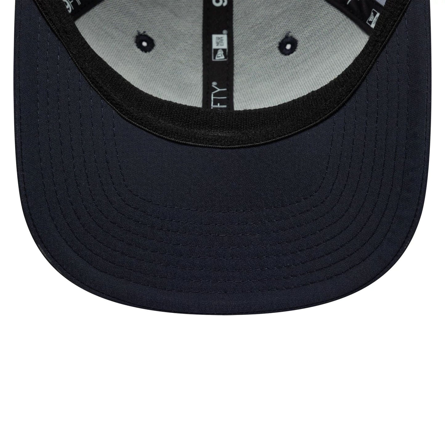 Pictured is this All Over Print Alpine Racing 9FIFTY Stretch Snap in navy. 5