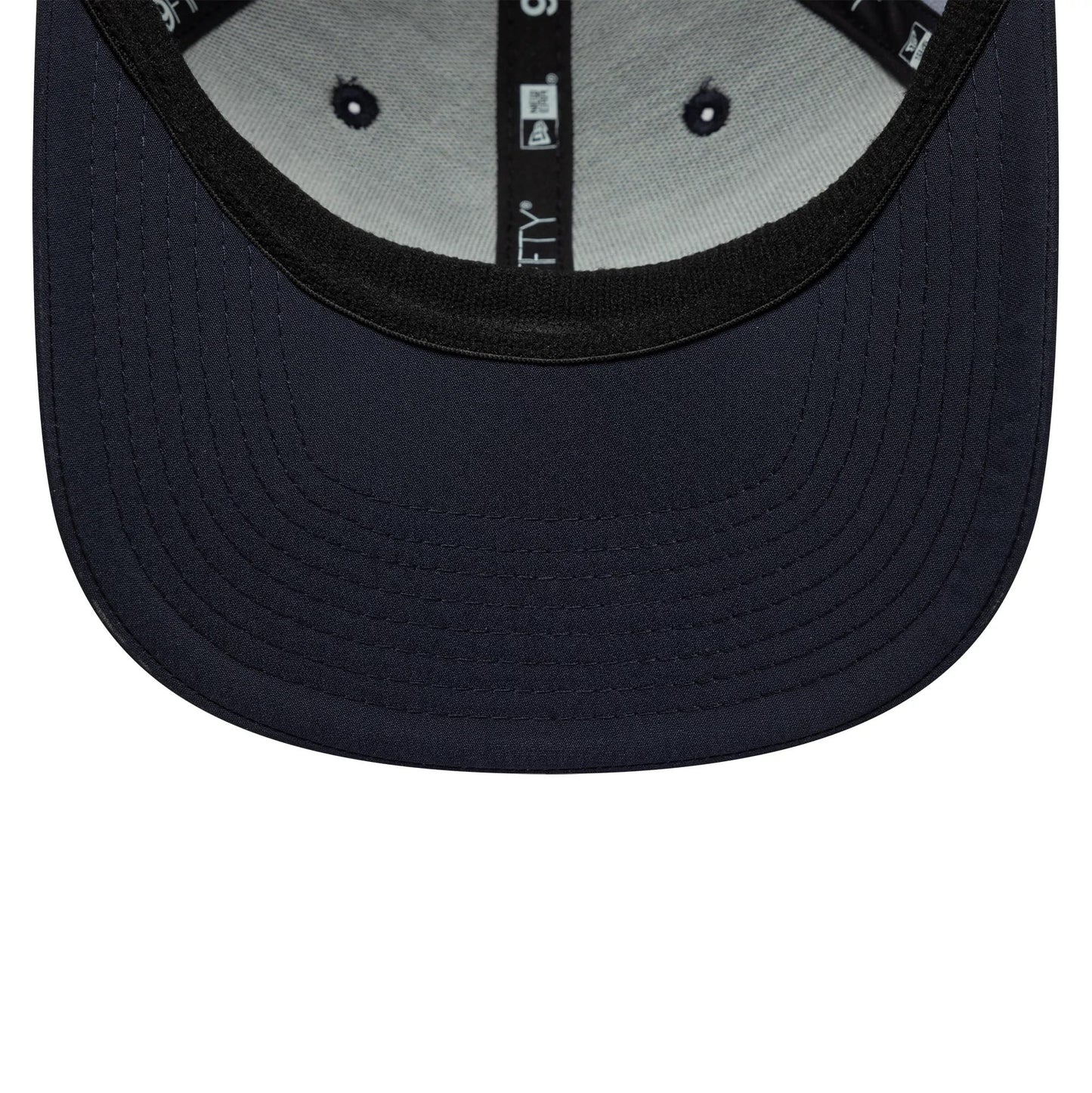 Pictured is this All Over Print Alpine Racing 9FIFTY Stretch Snap in navy. 5