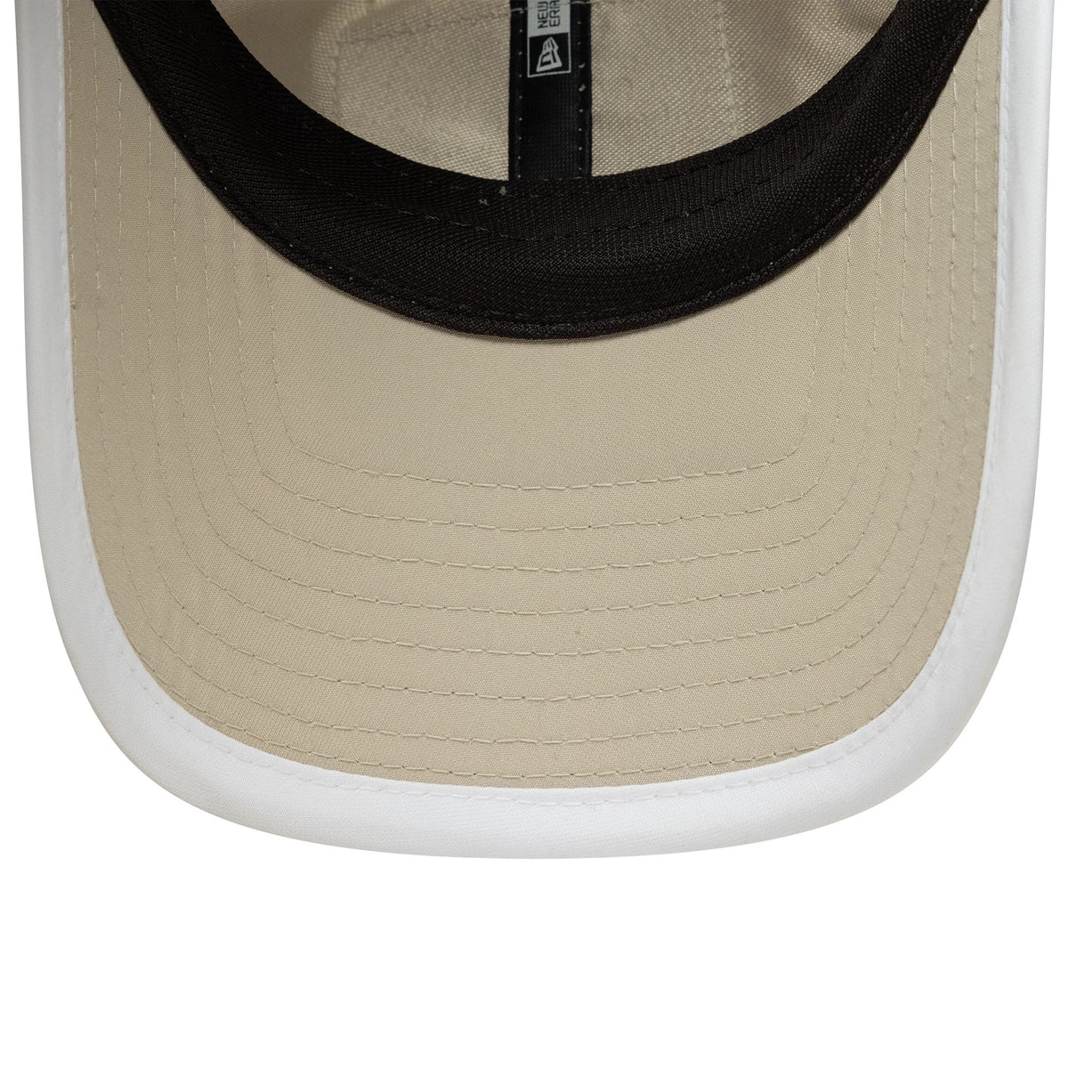 New Era Red Bull Racing Womens Light Beige Pony Tail Cap, inside view showing the black sweatband, beige undervisor with detailed stitching, and New Era branding on the internal taping.
