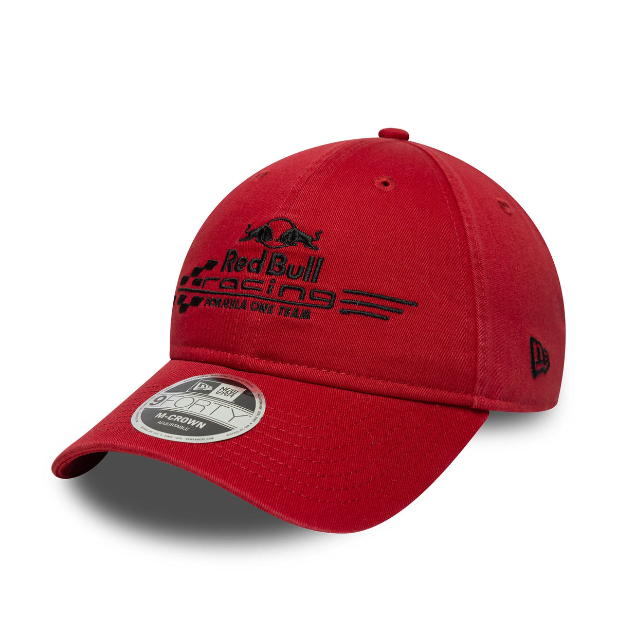 Red Bull Racing Washed Dark Red New Era 9FORTY M-Crown Cap, three-quarter view showing the black embroidered front logo of racing stripes and bulls, a curved visor with a 9FORTY size sticker, and the New Era flag logo on the left side.