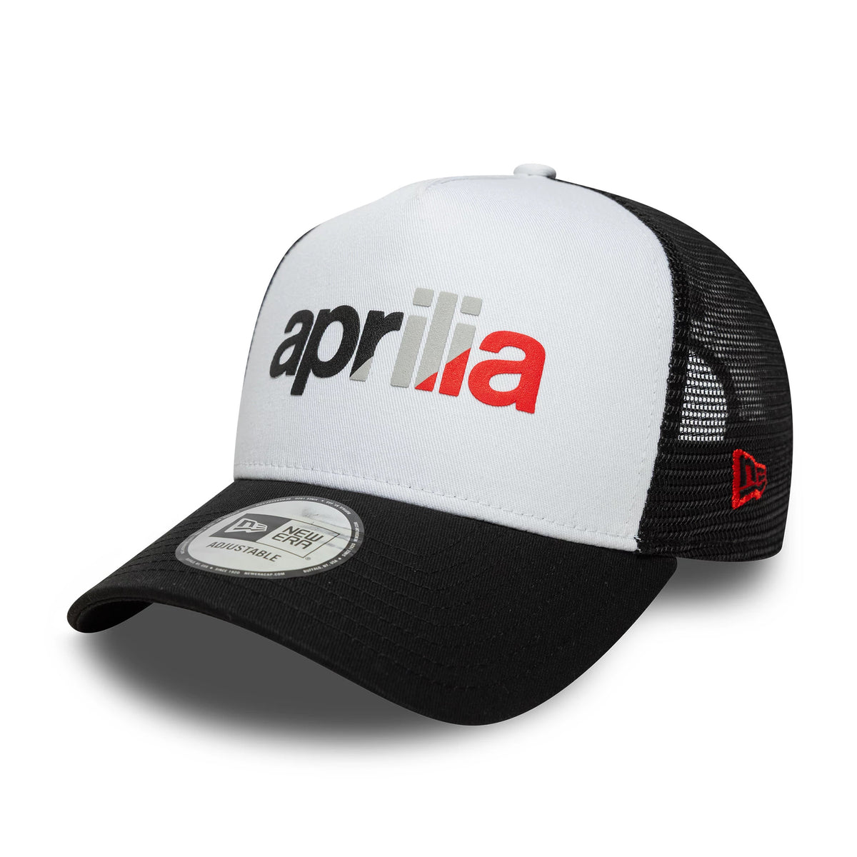 Aprilia Wordmark Black New Era 9FORTY A-Frame Trucker Cap, three-quarter view showing the black and red embroidered Aprilia logo on the white front panel, with a black curved visor and 9FORTY size sticker, plus red New Era flag logo on the side mesh.