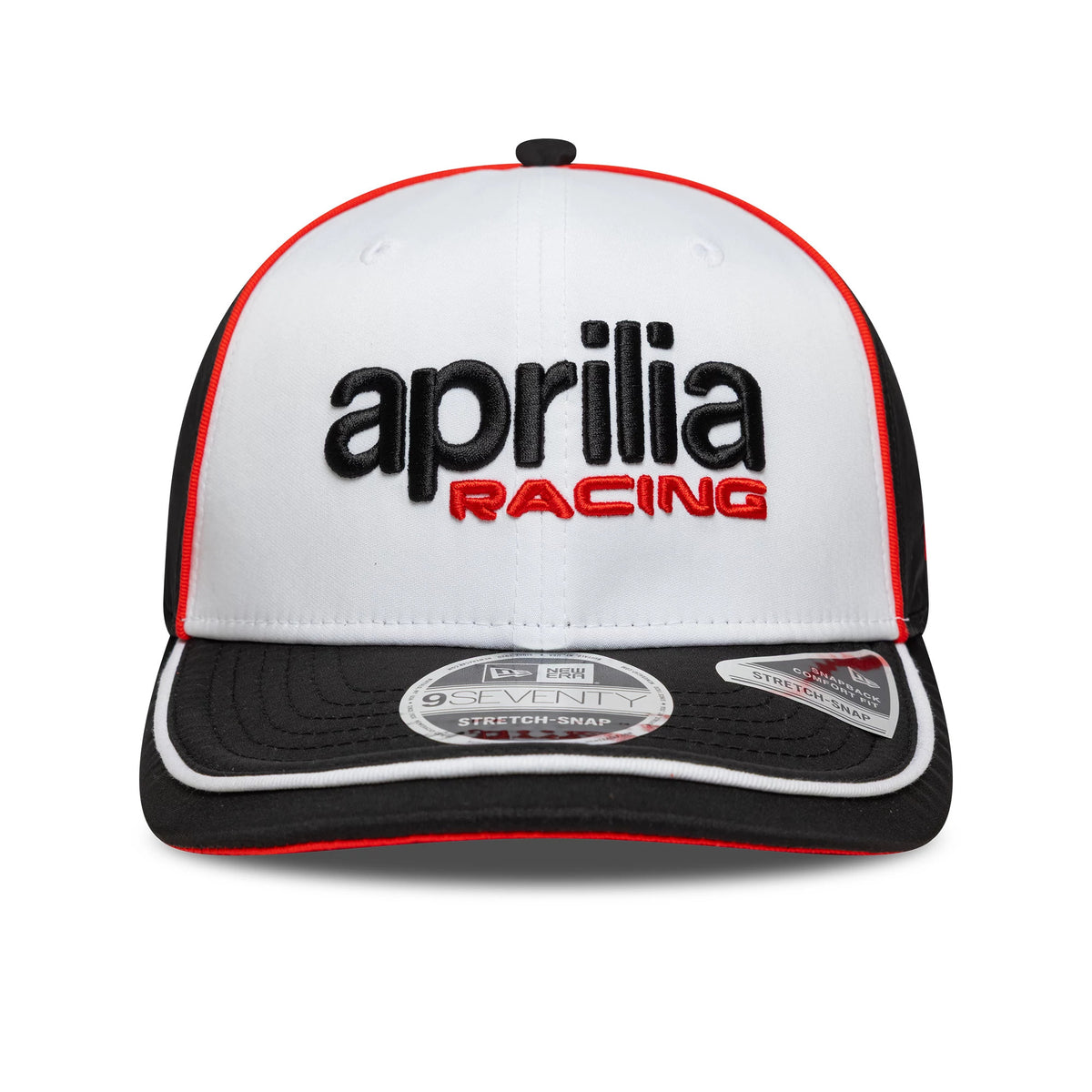 Aprilia Logo White New Era 9SEVENTY Stretch Snap Cap, front view showing black and red embroidered Aprilia Racing text on the white crown, with a black curved visor featuring a 9SEVENTY size sticker and red trim.