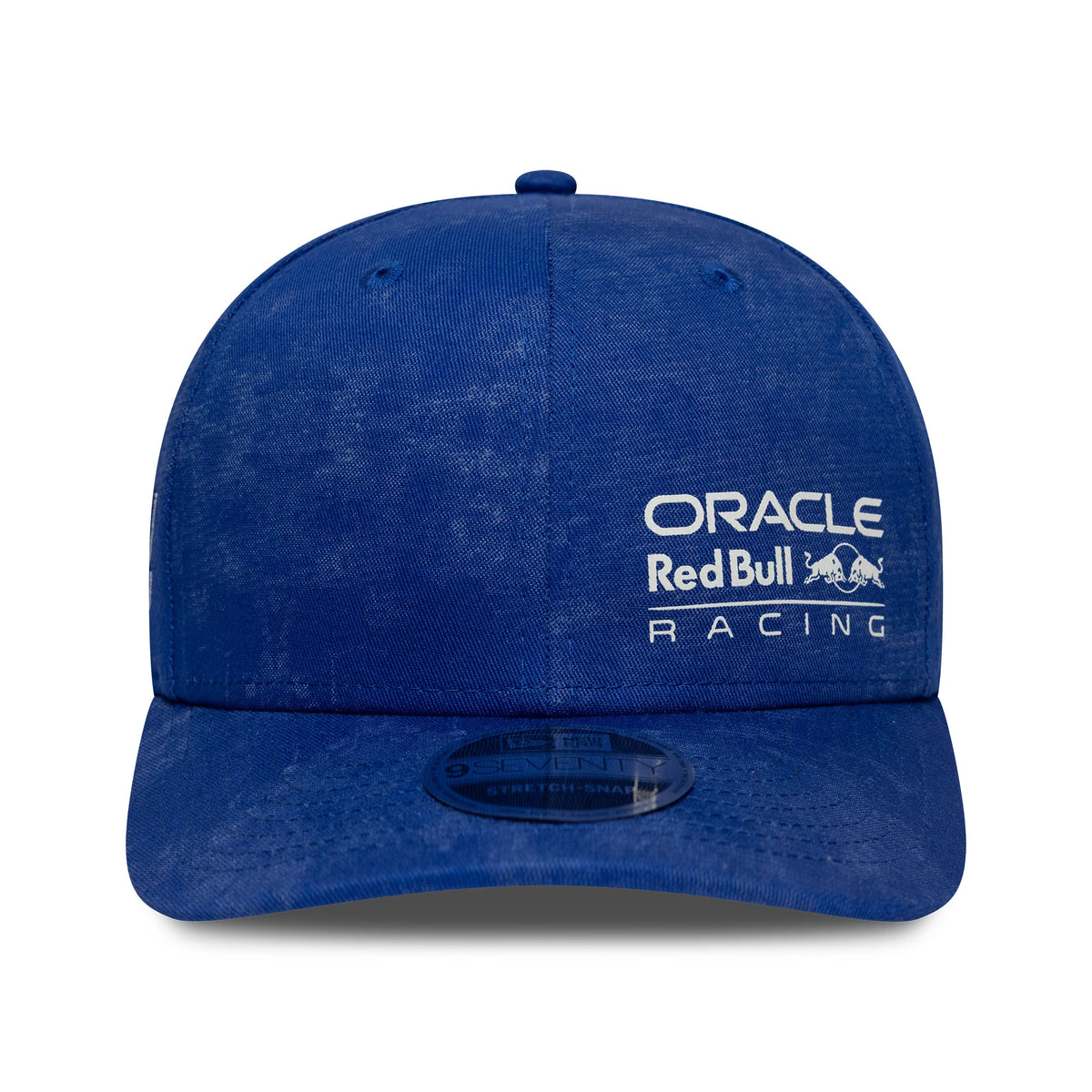 Red Bull Racing Washed Denim Blue New Era 9SEVENTY Stretch Snap Cap, front view showing white raised embroidery Oracle Red Bull Racing logo on the front panel with a black 9SEVENTY size sticker on the flat blue visor.