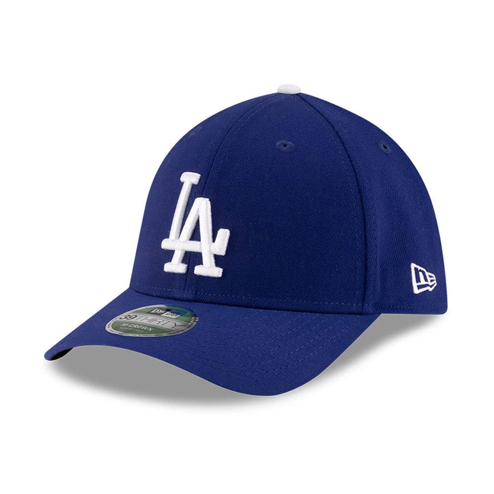 Dodgers MLB Player Replica Blue New Era 39THIRTY M-Crown Stretch Fit Cap, three-quarter view showing the white LA logo in raised embroidery on the front panel, curved visor with 39THIRTY size sticker, and New Era flag logo on the left side.