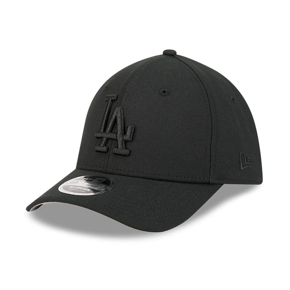 LA Dodgers MLB Outline Black New Era 39THIRTY M-Crown Stretch Fit Cap, three-quarter view showing the black embroidered LA logo on the front panel, curved black visor with a 39THIRTY size sticker, and the New Era flag logo on the left side.