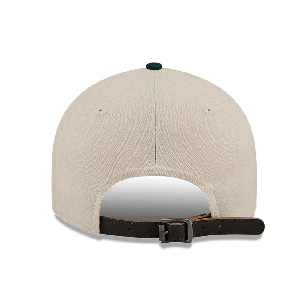 Athletics MLB Americana Herringbone White Retro Crown New Era 9FIFTY Adjustable Cap, rear view featuring a leather strap with buckle, showing the cream herringbone fabric and green top button on the structured crown.