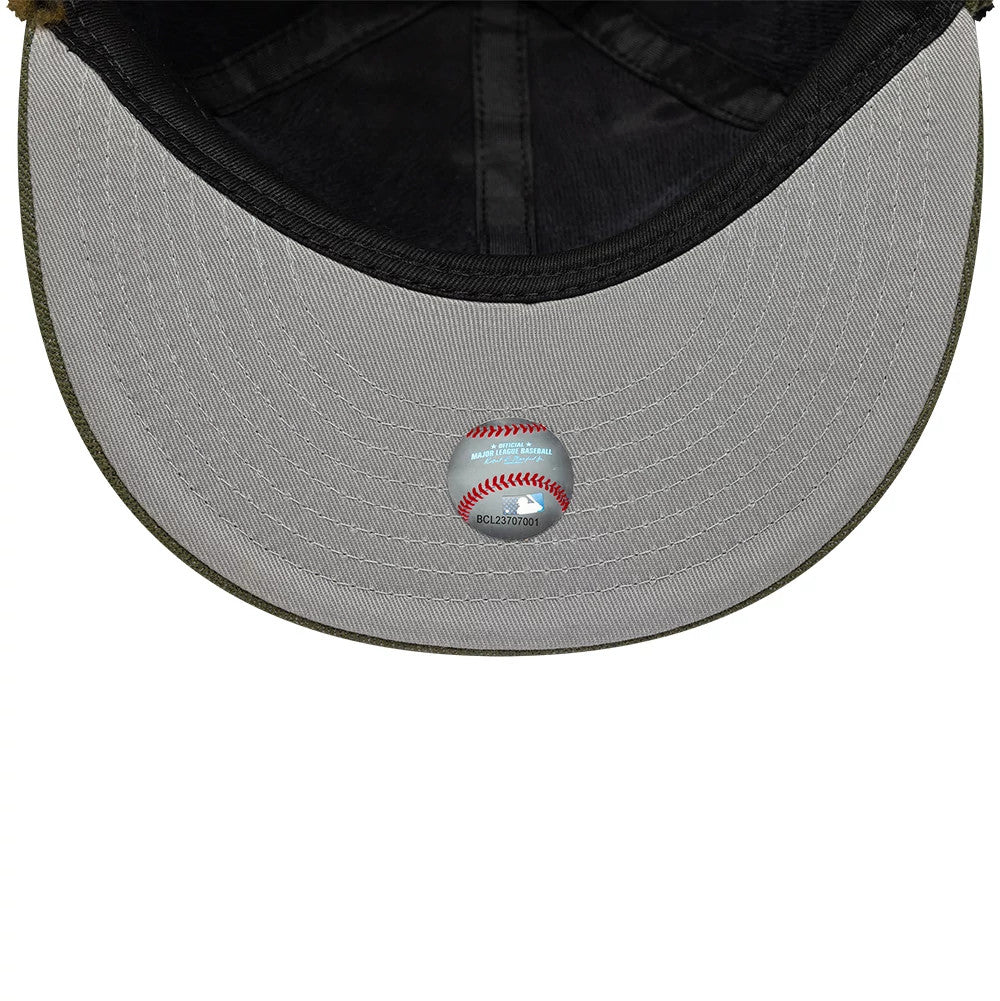 New York Mets MLB Camo Open Green Retro Crown Dogear New Era 59FIFTY Fitted Cap, inside view showing the grey undervisor with a baseball hologram sticker and dark taping along the interior seams.