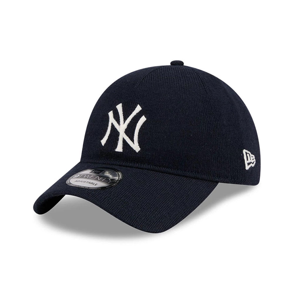 New York Yankees MLB Merino Wool Navy New Era 9TWENTY Adjustable Cap, three-quarter view showing the white embroidered NY logo on the front panel, curved navy visor with 9TWENTY size sticker, and New Era flag logo on the left side.