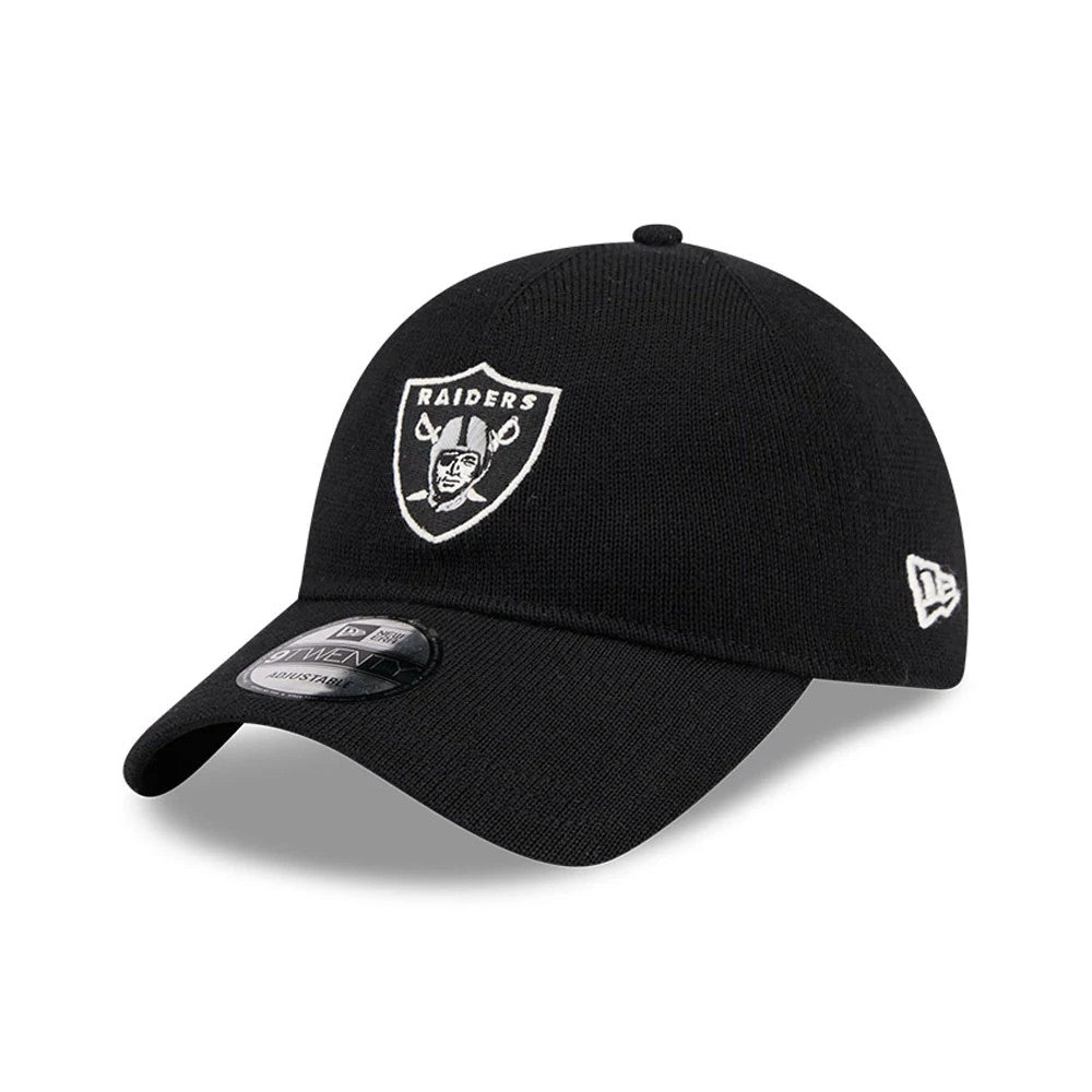 Las Vegas Raiders NFL Merino Wool Black New Era 9TWENTY Adjustable Cap, three-quarter view showing the white raised embroidered Raiders logo on the front panel, bent black visor with 9TWENTY size sticker, and white New Era flag logo on the left side.