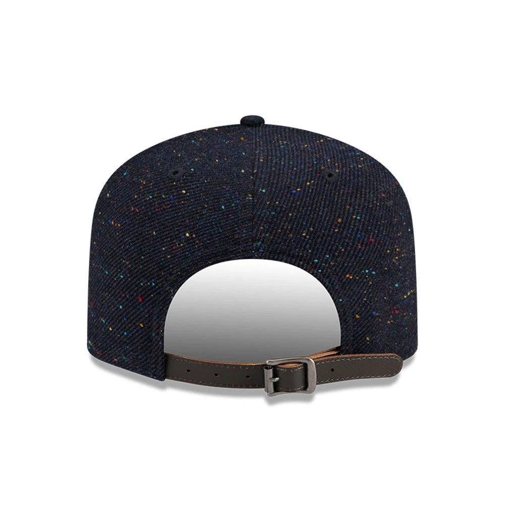 Houston Astros MLB Speckled Wool Navy New Era 19TWENTY Adjustable Cap, rear view showing the multicoloured speckled pattern on the wool fabric and a brown leather strap with buckle for adjustment at the base of the crown.