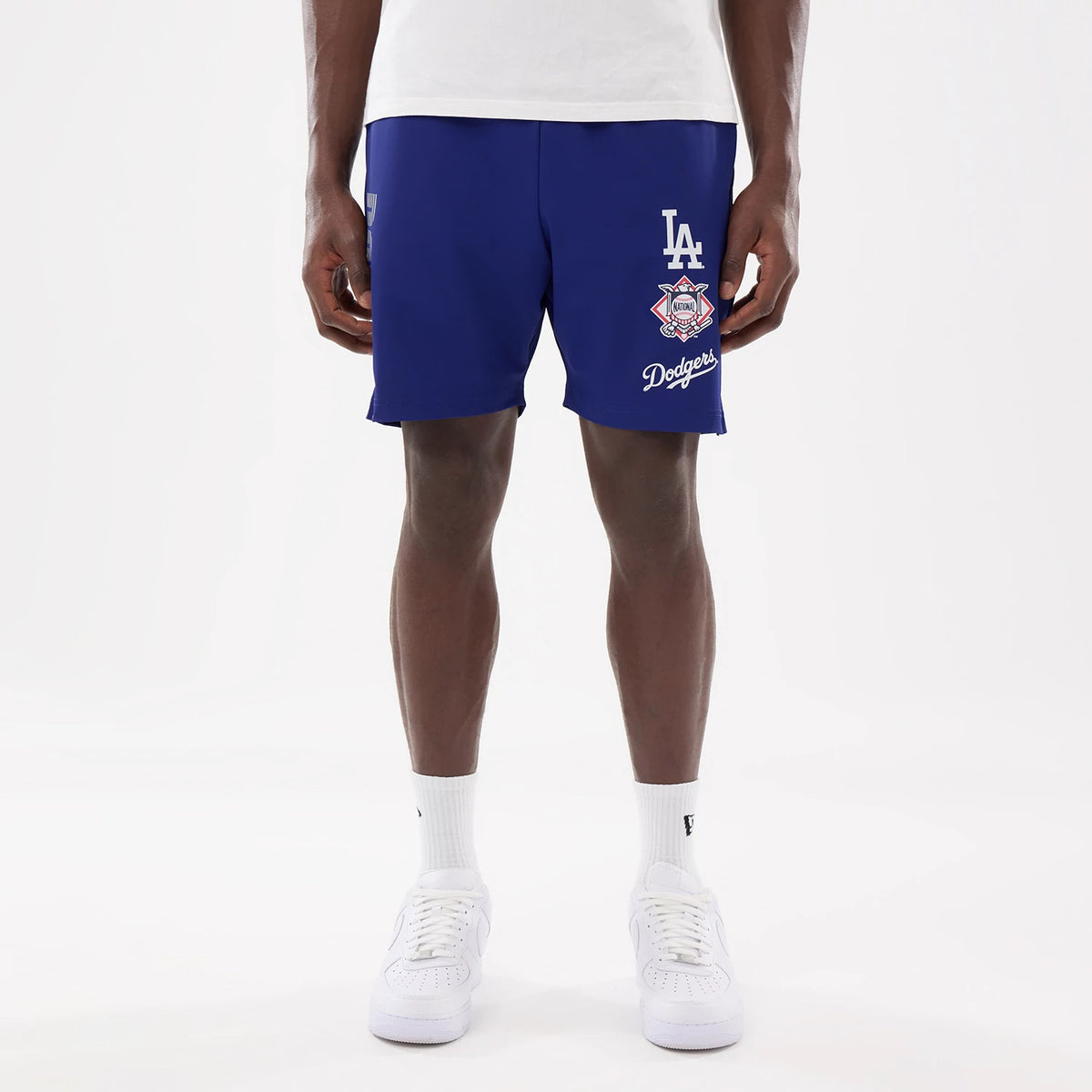 The model is wearing this MLB Match LA Dodgers Oversized Shorts in dark blue. 1