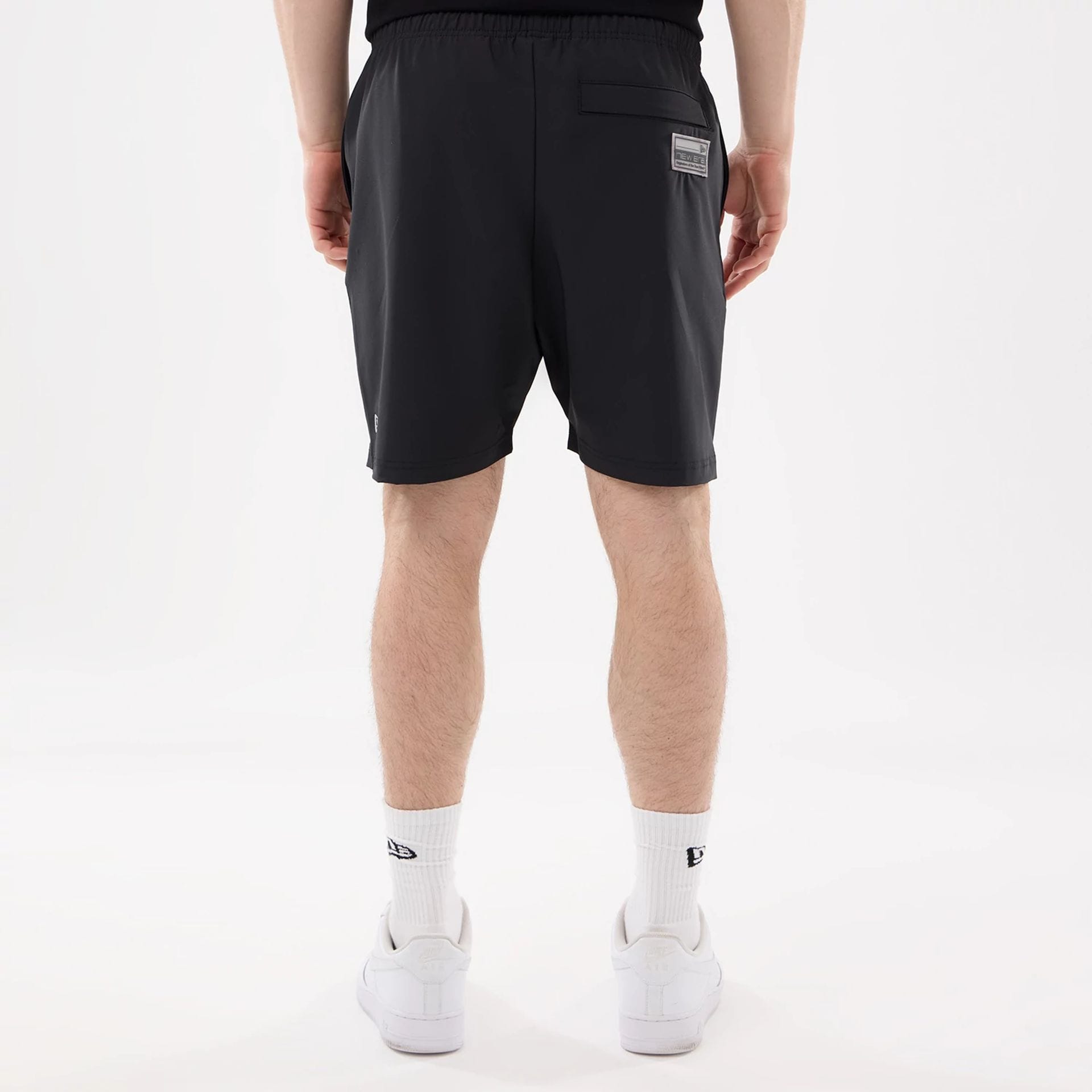 The model is wearing this NFL Match Las Vegas Raiders Oversized Shorts in black. 2