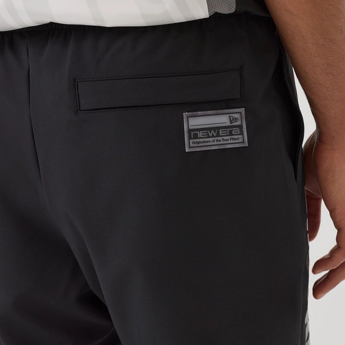 The model is wearing this NBA Match Brooklyn Nets Oversized Shorts in black. 7