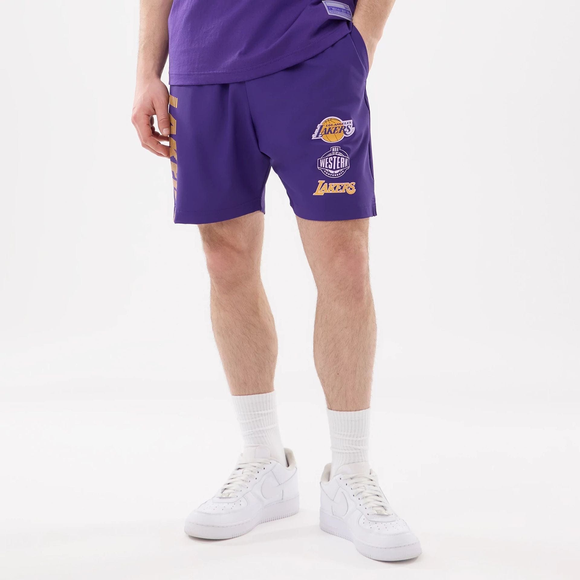 The model is wearing this NBA Match LA Lakers Oversized Shorts in purple. 1