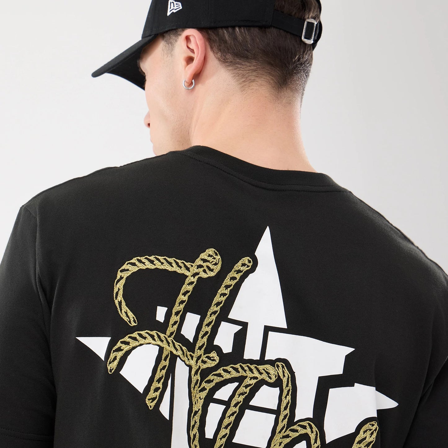 The model is wearing this MLB Cowboy Graphic Houston Astros T-Shirt in black. 7