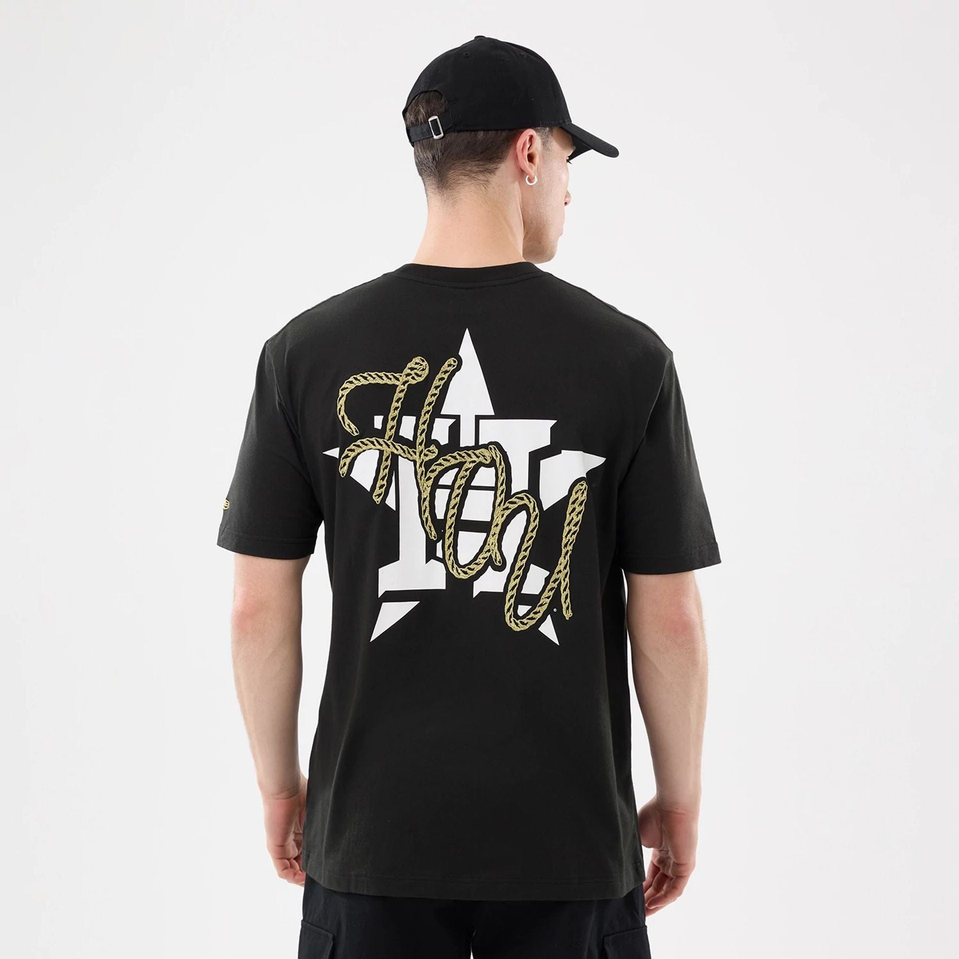 The model is wearing this MLB Cowboy Graphic Houston Astros T-Shirt in black. 2