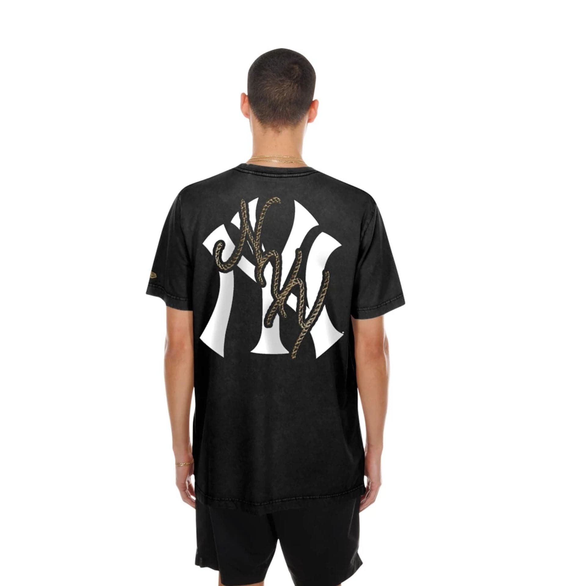 The model is wearing this MLB Cowboy Graphic New York Yankees T-Shirt in black. 2