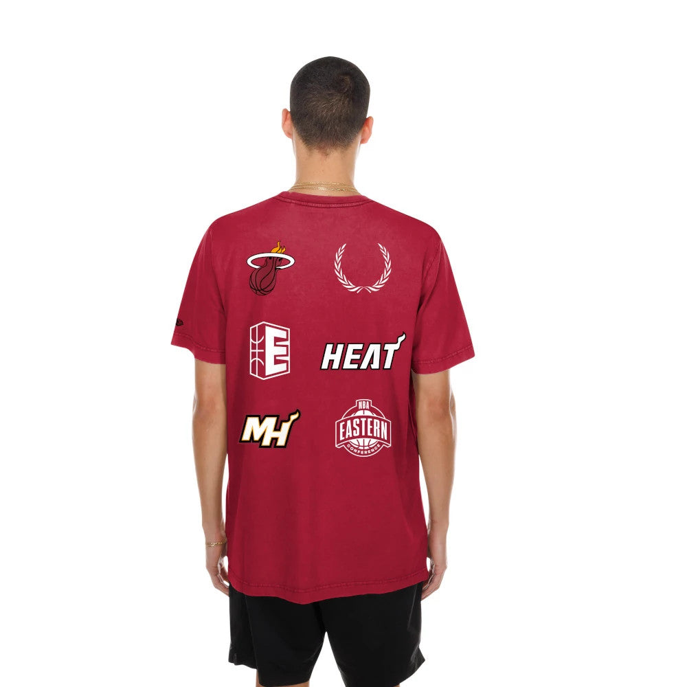 New Era Miami Heat NBA Match Dark Red T-Shirt, back view on a model showing multiple graphics including the Heat logo, a laurel wreath, the letter E, and Eastern conference basketball design across the shoulders and back.