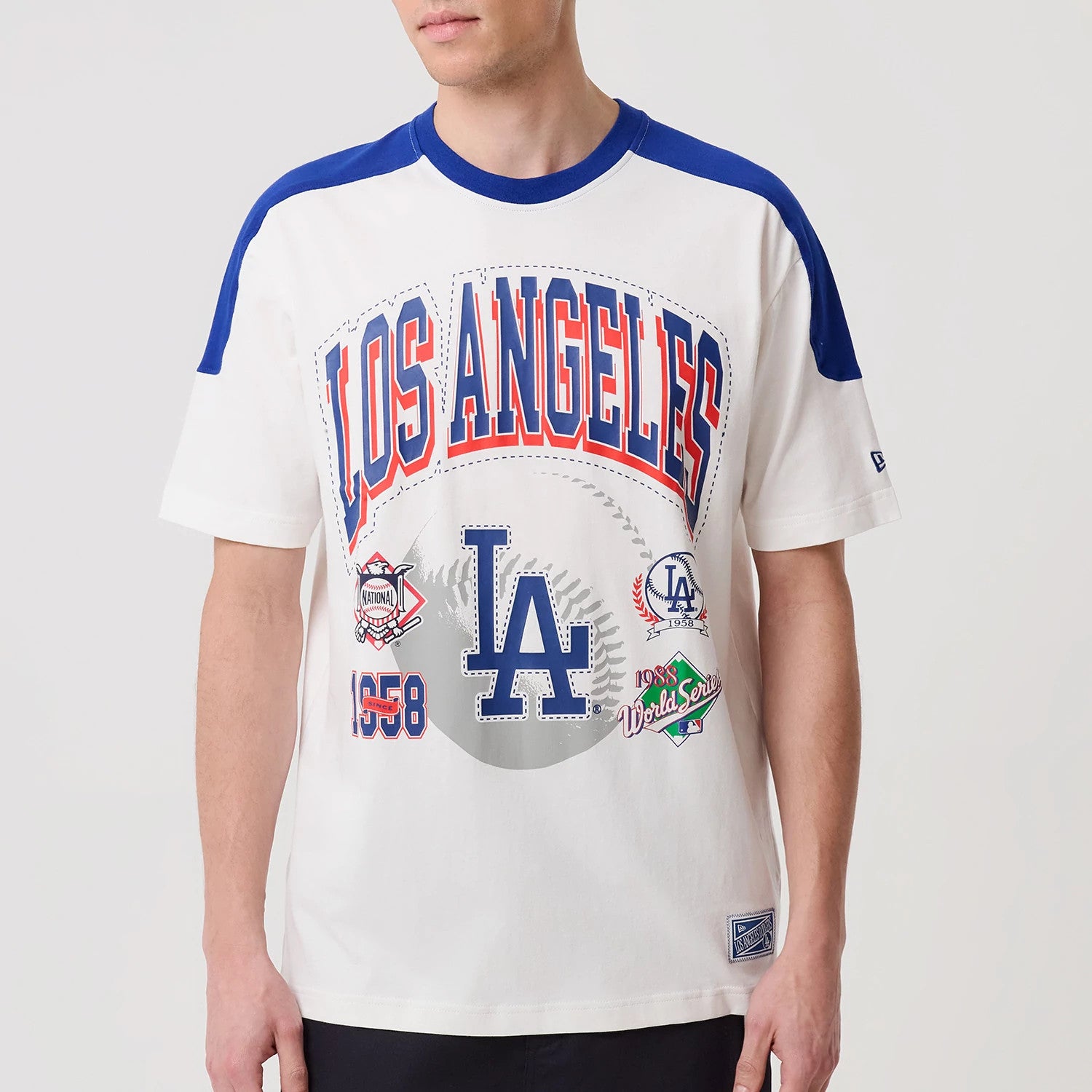The model is wearing this MLB Sport Classic LA Dodgers T-Shirt in white. 4