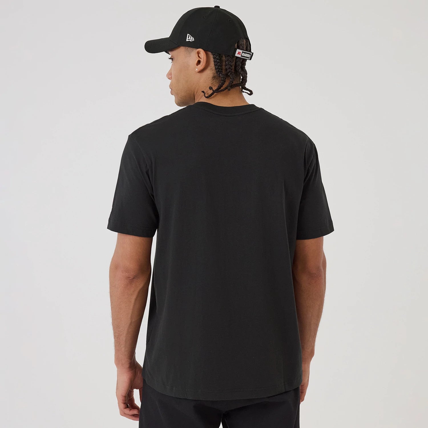 The model is wearing this NFL Sport Classic Las Vegas Raiders T-Shirt in black. 2