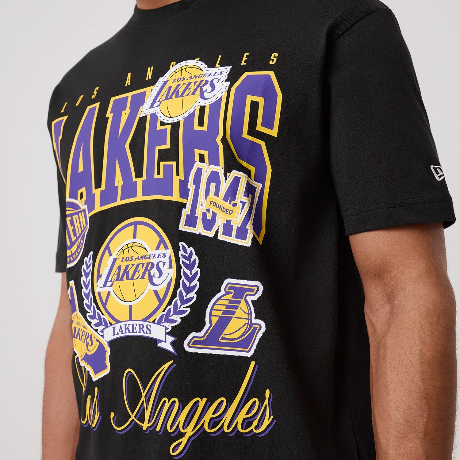 The model is wearing this NBA Sport Classic LA Lakers T-Shirt in black. 4