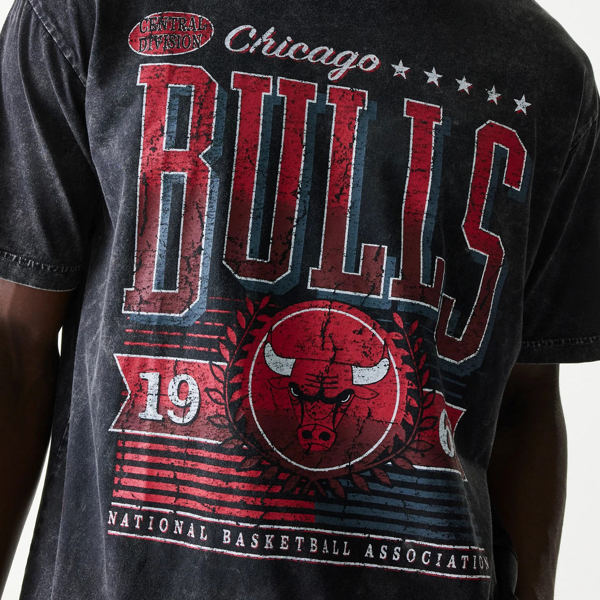 New Era Chicago Bulls NBA Black T-Shirt, back view showing a large distressed red Bulls logo with team lettering, stars above the name, and additional graphic elements including the number 19 and National Basketball Association text.
