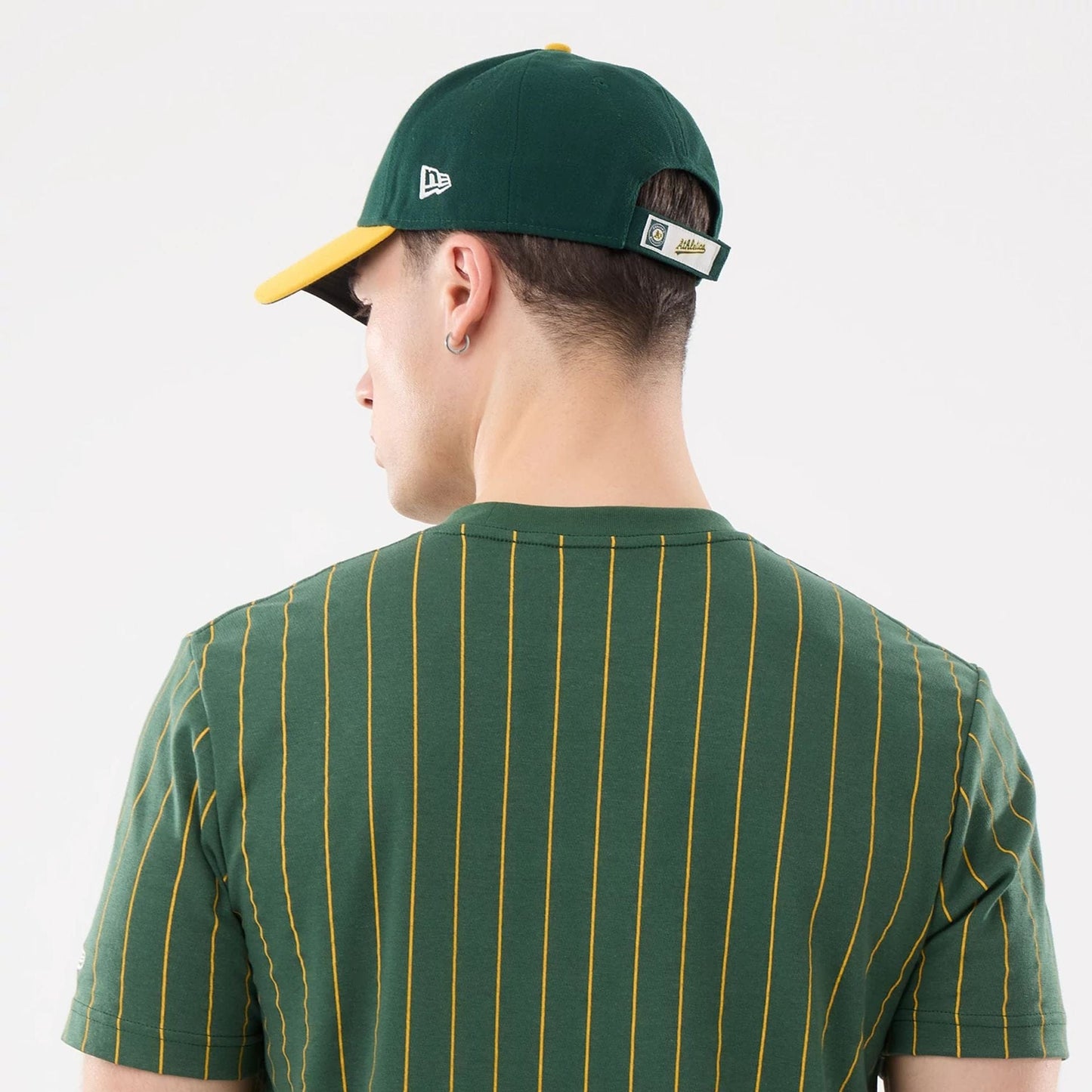 The model is wearing this MLB Pinstripe Athletics T-Shirt in dark green. 5